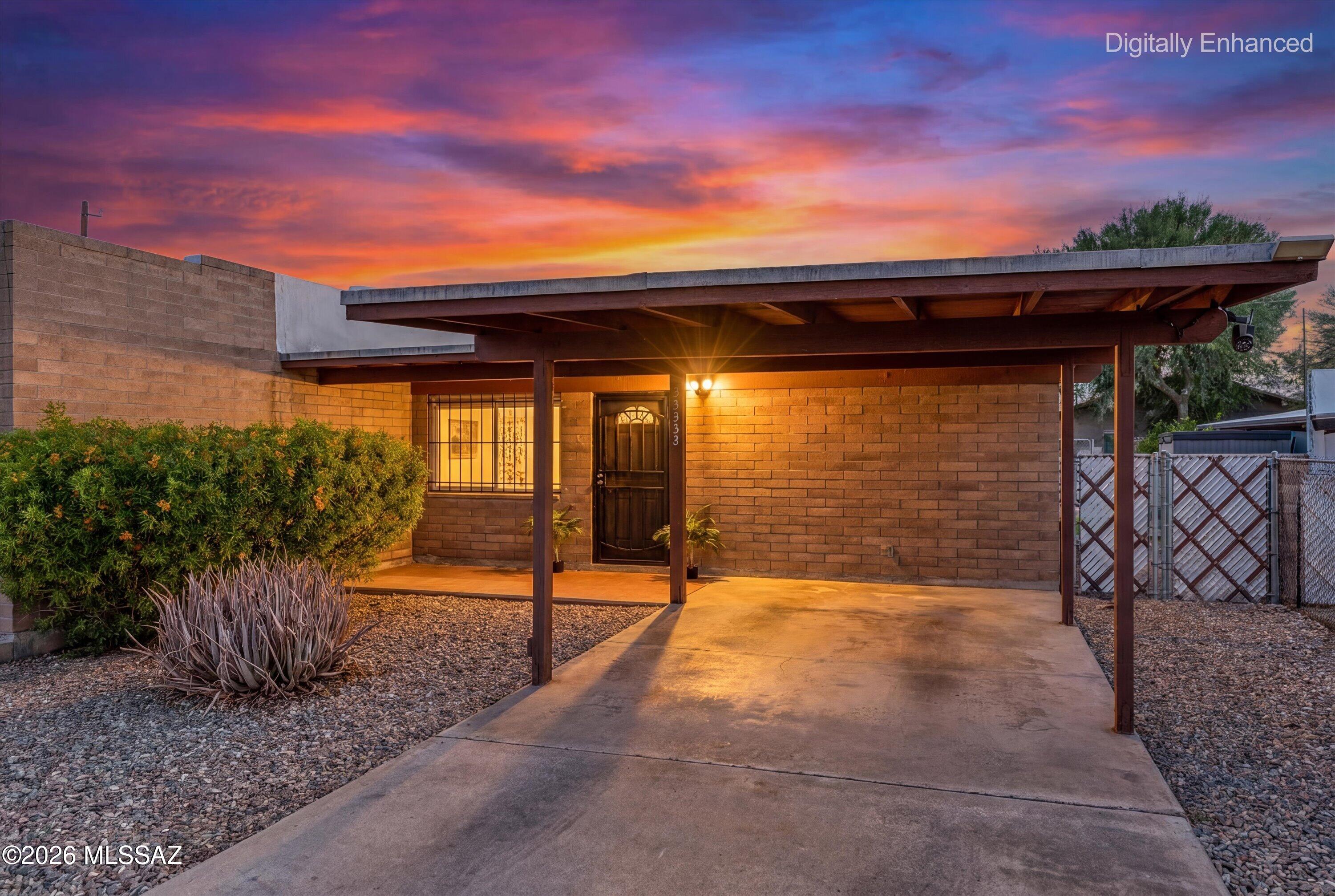 Small, Boutique Neighborhood in the heart of Central Tucson.  Fabulous location, convenient to U of A, TMC, many medical facilities, The Loop, and Winterhaven Christmas Lights Event!   Updated townhome with cheerful ambiance.  Open floorplan, lots of natural light, large bedrooms and 2 baths.  Kitchen with ample counter space and cabinets are abundant.  Recessed lighting is a plus. NO CARPET!  Wood plank laminate throughout.  Carport is on East side and is shaded the majority of the day.  Large back patio perfect for entertaining and a pull down sun shade for privacy and comfort.  Newer HVAC unit and hot water heater.  Please consider using Pamela M Baker, Producing Regional Manager, On Q Home Loans.  (480) 444-7128