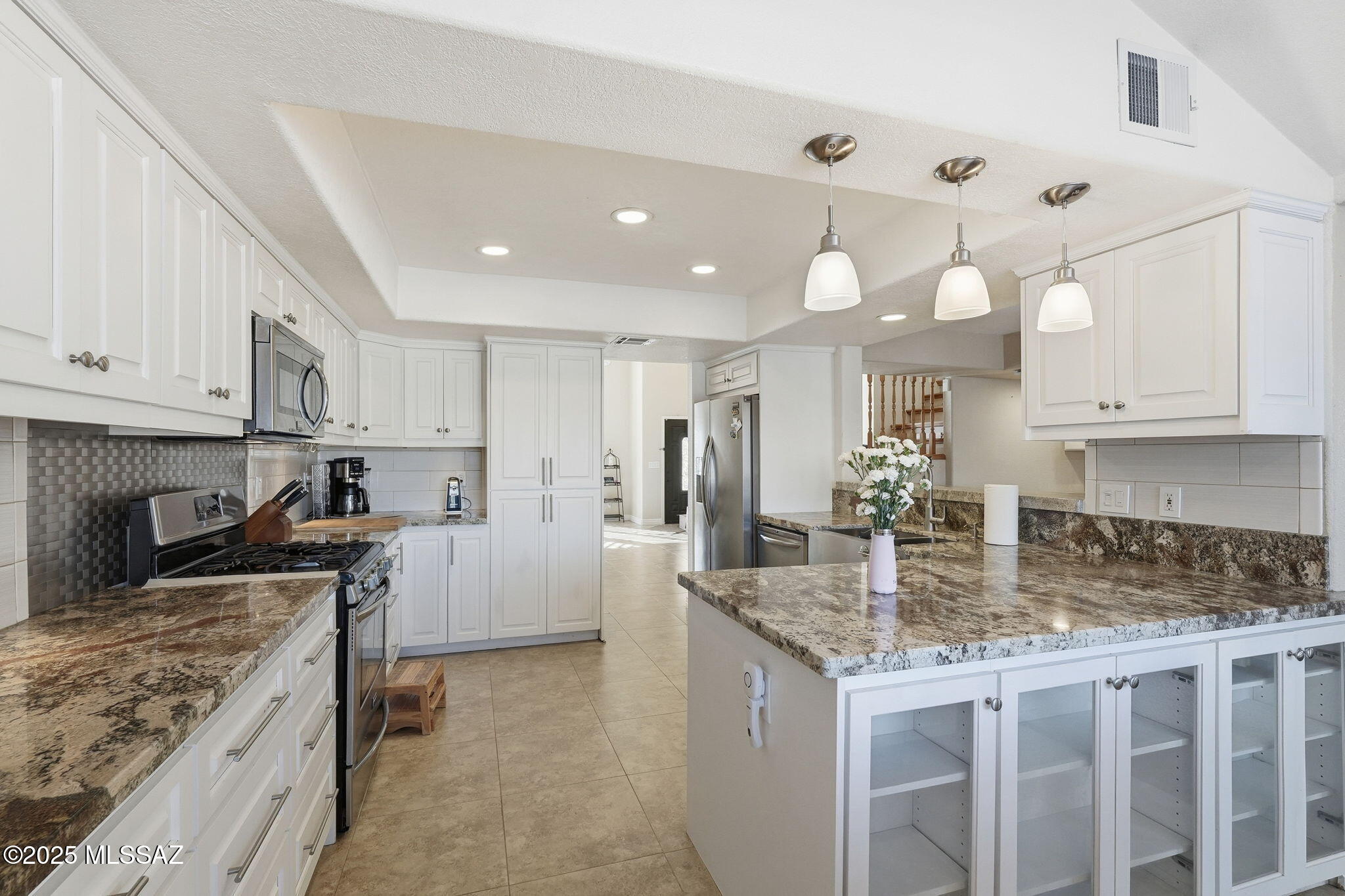 Perfect for Entertaining! Beautifully maintained unique 7-bedroom, 4-bath home on Tucson's desirable East Side neighborhood offering sophistication, comfort, and functionality. Top-rated schools, shopping, and dining with blends of convenience and tranquility within a 3-mile radius. An extra-large lot with plenty of room to relax, play, and entertain. Perfect for a growing family or multi-generational living. Natural light throughout--inside and outside. The modern kitchen is a showstopper, featuring River Bordeaux granite countertops, sensor faucet, soft-close cabinetry, and abundant storage—perfect for any home chef. With its combination of size, location, and style, this home truly offers the best of Tucson living—a place to build memories for years to come.