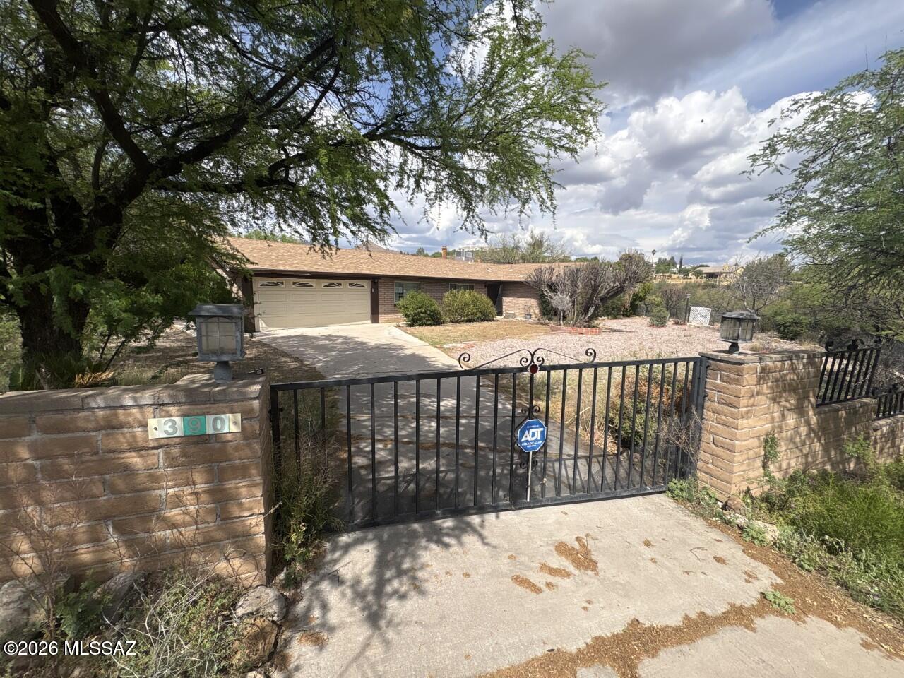 Stunning ranch-style retreat on 0.85 acres! Nestled on a quiet cul-de-sac in Rio Rico Estates, this bright 3-bed, 2-bath home delivers big-sky living with mountain views and room to roam. Inside, a spacious living room flows into the dining area, while the kitchen boasts a center island and pantry. Outside, the oversized covered patio is perfect for BBQs, sunset gatherings, or simply soaking up the Arizona sunshine. Slump-block charm, 2-car garage, no HOA, and privacy galore--this family favorite is ready for your next chapter!