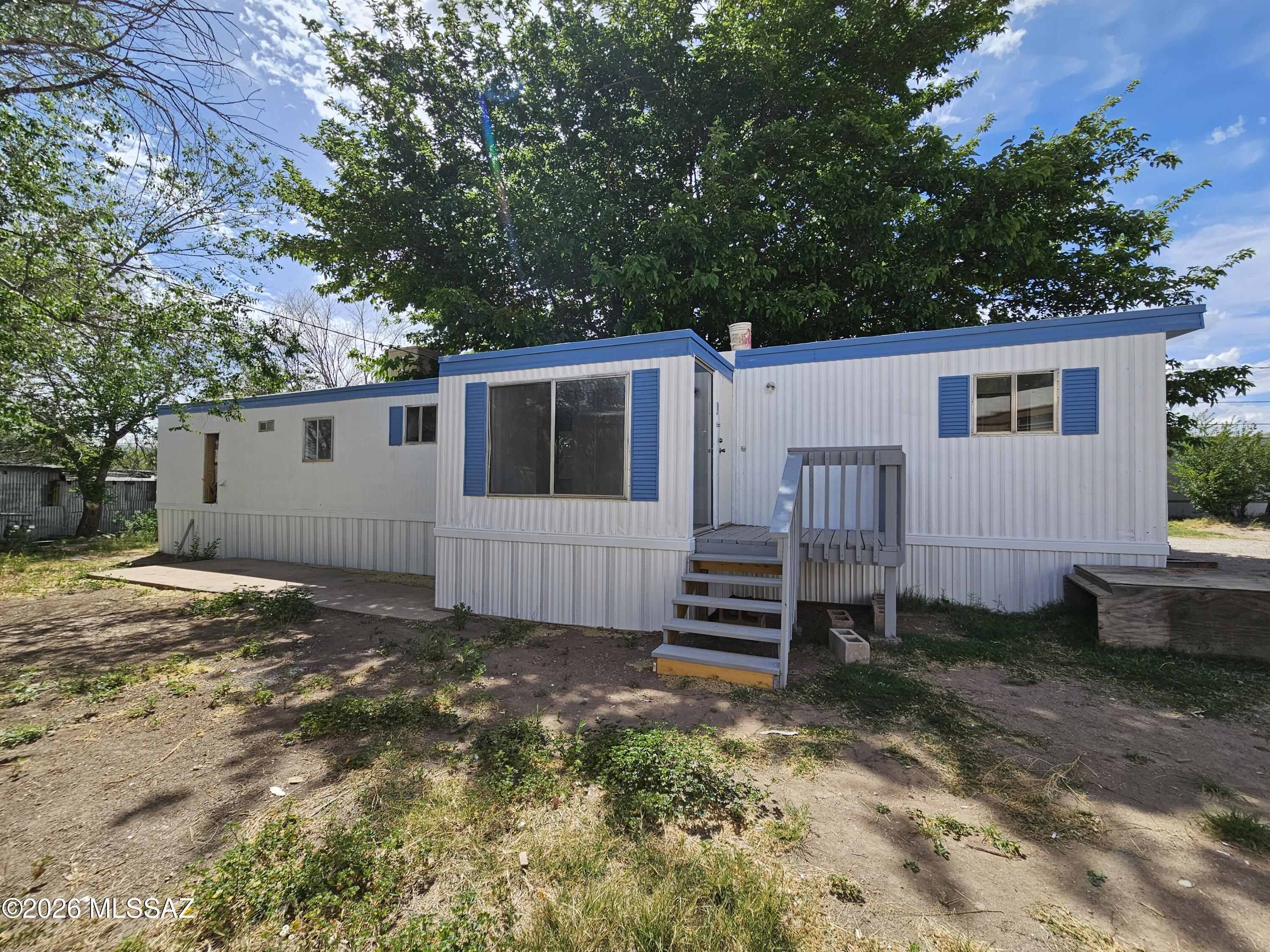 Freshly updated. Cozy and move in ready! Open and bright floor plan. New flooring. Freshly painted inside and out. Lots of cool shade. Front and back decks. This is a great value.