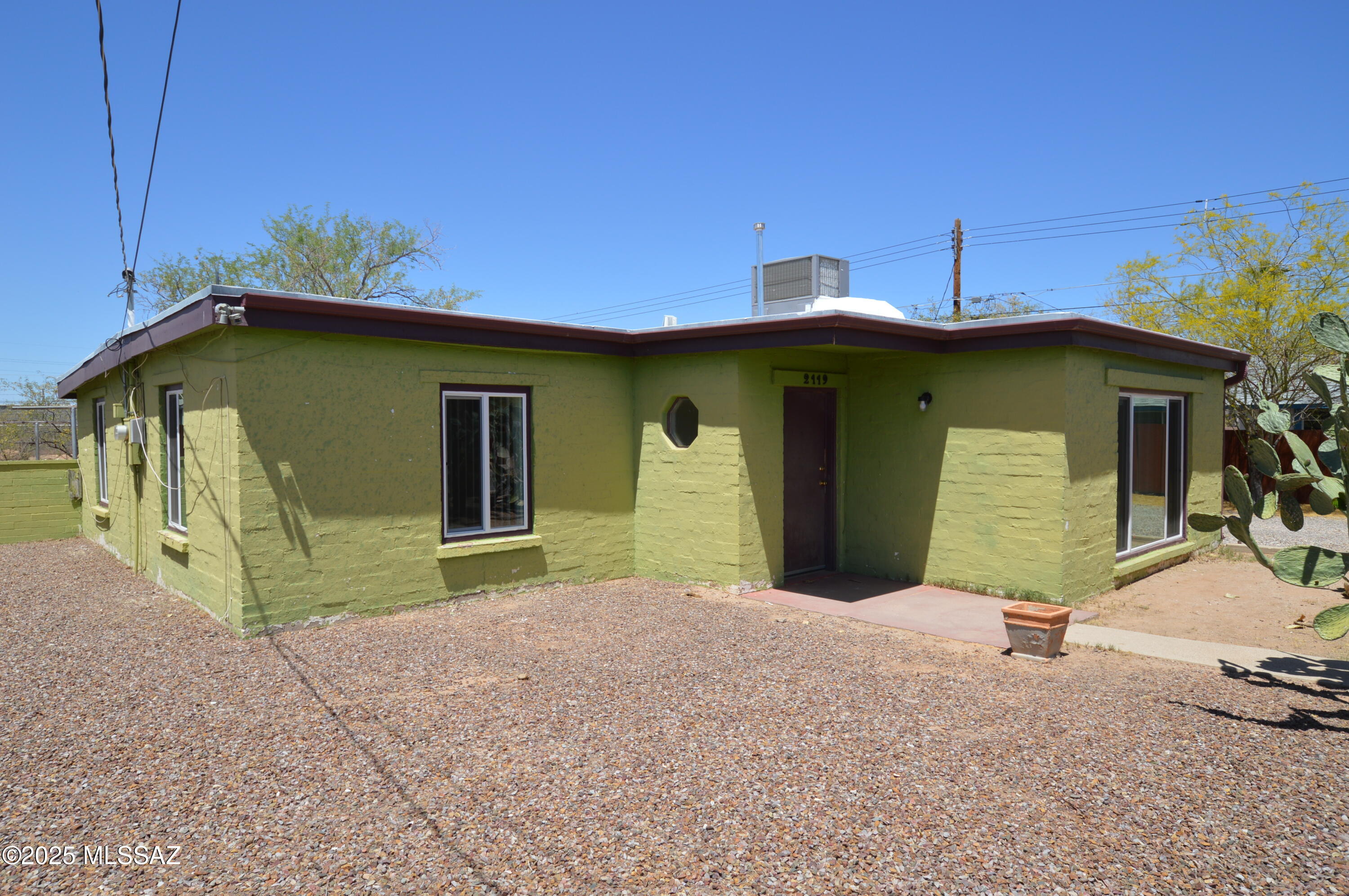 Newer paint, updated kitchen, nearly new AC and newer double-paned windows! This home is just waiting for YOU! Large front-facing living room with built in bookcases! Newly updated kitchen with lots of new hardware and cabinets! ENORMOUS master bedroom with large closet! One large secondary bedroom and a smaller one that could easily convert to an office space!  Don't wait on this excellent home! CALL TODAY!! Access to the outbuilding withheld. Owners are licensed for real estate in AZ.