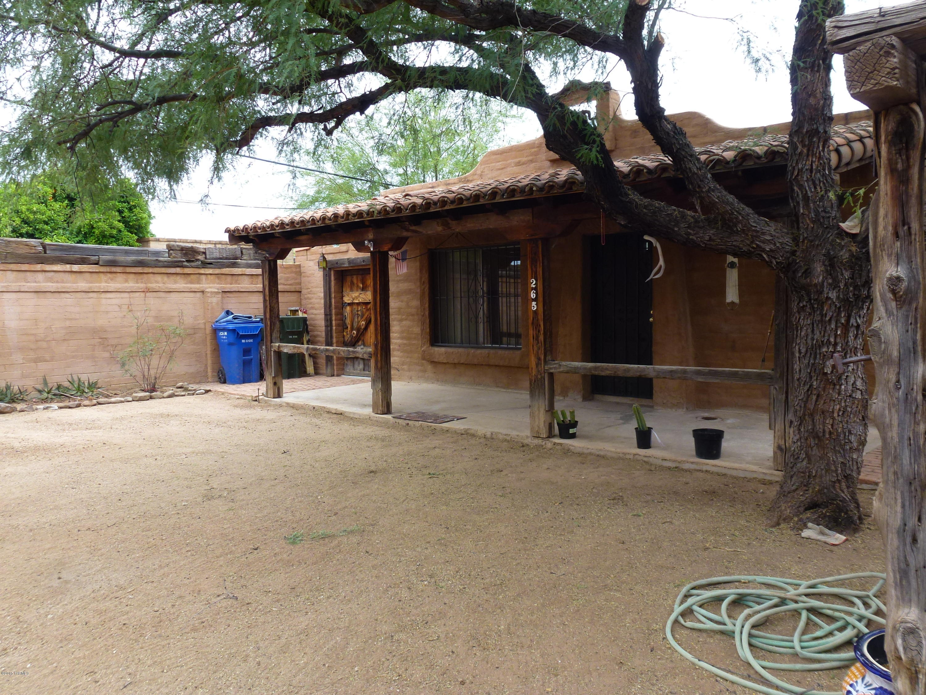 Tucked back and very private behind the main house. One parking spot in the front and a walkway to the locked gate takes you to the lovely large court yard and covered patio. Separate enclosed laundry room and additional spacious storage too. Walk into the very qwaint living space with a beehive fireplace and separate bedroom. Perfect for peaceful, tranquil living. Call for an immediate showing.
