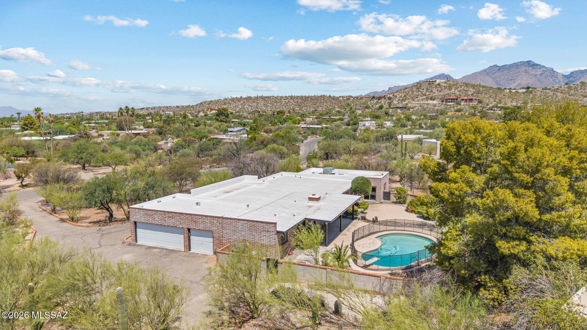 Incredible investment opportunity on over an acre with a pool in the highly desirable Sabino Vista Heights neighborhood. The main home features a 3-car garage, 4 bedrooms, and 3 full bathrooms. The original 5th bedroom was thoughtfully converted into an attached mother-in-law suite complete with a spacious living area, kitchenette, full bathroom, walk-in closet, and its own private 1-car garage. Whether you're looking for multigenerational living, guest accommodations, a private home office, or potential rental income, this flexible floor plan offers endless possibilities.

Just minutes from Sabino Canyon, Ventana Canyon, Whole Foods, and the Catalina Foothills' premier shopping and dining, this home offers the perfect blend of privacy, convenience, and outdoor living.
