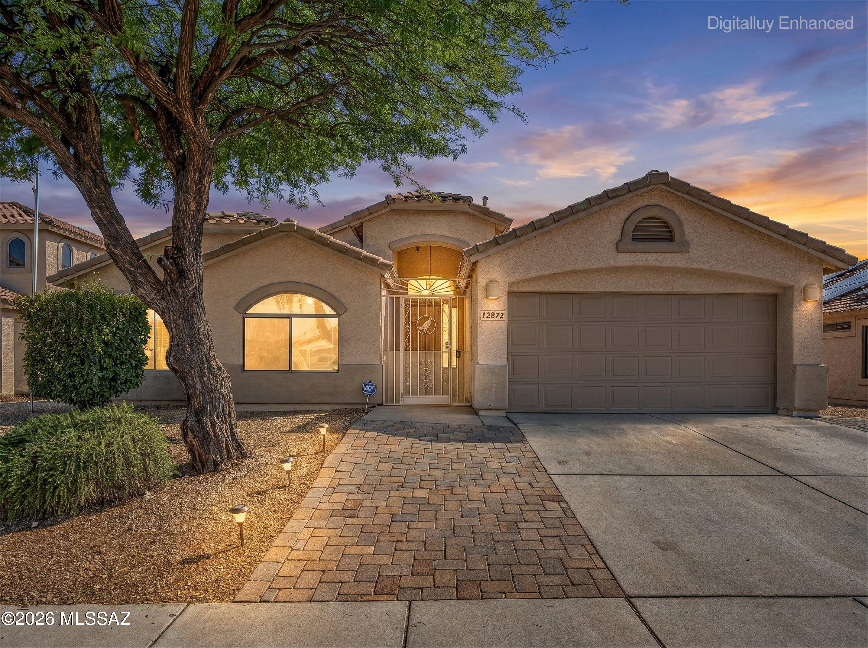 Bright and open, this four bedroom, two bath home in Vail offers 1,862 square feet with vaulted ceilings and a layout full of natural light. The garage stands out with added lighting and storage. Out back, a large covered patio and mature shade trees set the stage for a backyard built for real use: half in ground heated spa, real grass, pavers, and flagstone with plenty of space to entertain. Located in the award winning Vail Unified School District and just minutes away from shopping, don't miss out on your opportunity to make this house your home.