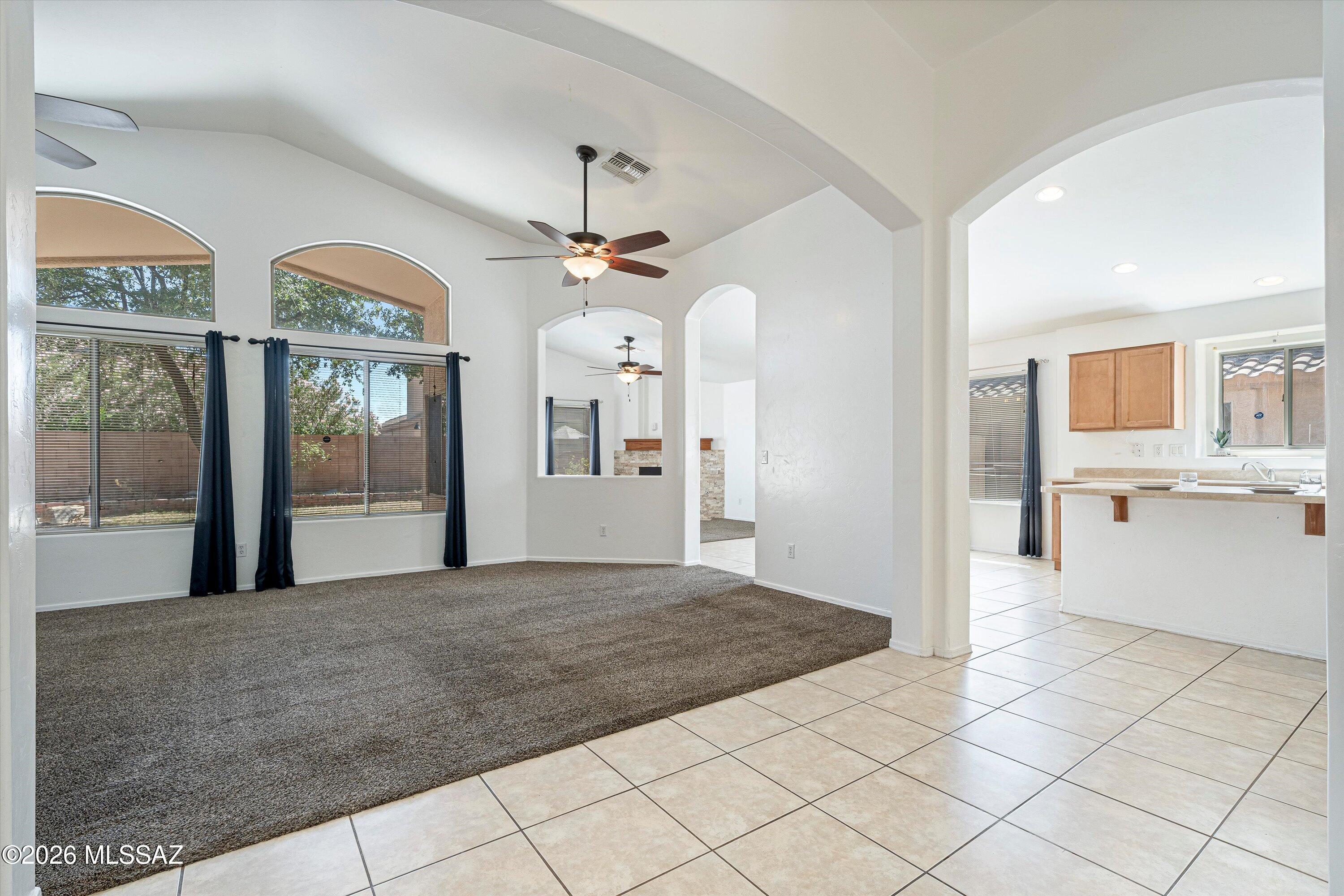 Bright and open, this four bedroom, two bath home in Vail offers 1,862 square feet with vaulted ceilings and a layout full of natural light. The garage stands out with added lighting and storage. Out back, a large covered patio and mature shade trees set the stage for a backyard built for real use: half in ground heated spa, real grass, pavers, and flagstone with plenty of space to entertain. Located in the award winning Vail Unified School District and just minutes away from shopping, don't miss out on your opportunity to make this house your home.