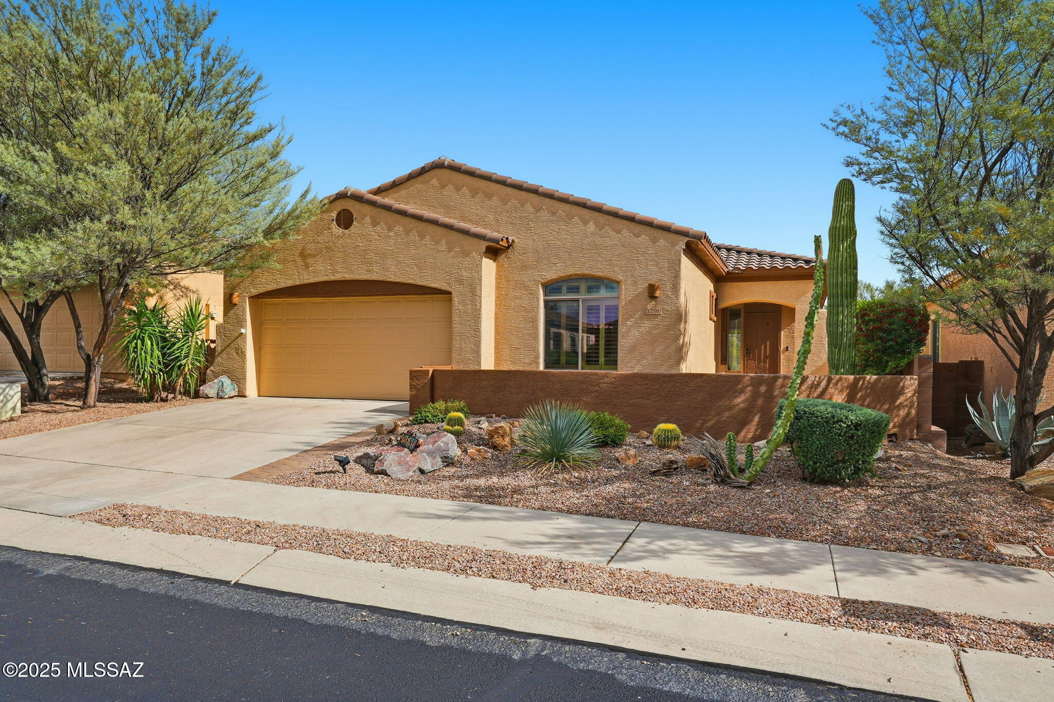 Enjoy stunning mountain views and serene desert landscapes from this beautifully maintained home located in the desirable gated community of ''The Preserve'' at Dove Mountain.  The open-concept floor plan is perfect for entertaining.  Featuring a spacious great room, easy-care ceramic tile throughout, granite kitchen counters, and brand-new appliances. Step outside to your back yard retreat with heated pool and spa, a brand-new misting system, and new irrigation. Move-in ready and waiting for you to enjoy those sunny desert days and starry nights.