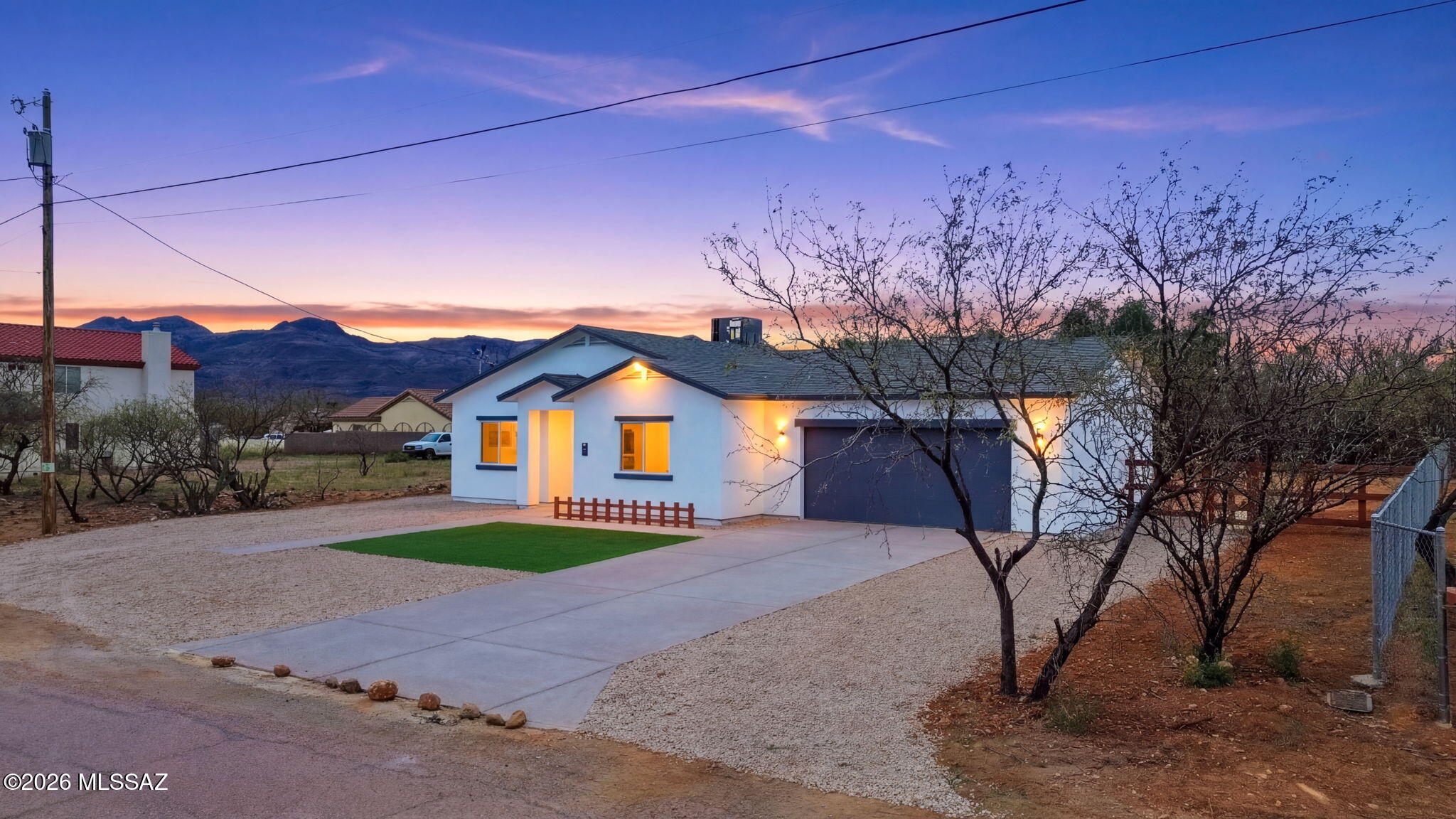 This brand-new 3-bedroom, 2-bath home showcases quality finishes throughout and features an open floor plan designed for comfortable living and entertaining. The custom kitchen is the heart of the home, complete with quartz countertops, a large island, stainless steel appliances, and plenty of space for gathering. The home also features custom-designed bathrooms, recessed lighting, ceiling fans, and stylish two-tone paint that adds a modern touch. Additional highlights include city water, a septic system, a spacious two-car garage, and a long driveway offering ample parking.
Set on a generous 11,250 sq. ft. lot, the front yard is clean and low-maintenance with artificial grass, while the expansive backyard offers a blank canvas ready for you to design the outdoor space of your dreams. A covered patio provides the perfect place to relax and take in the peaceful surroundings and beautiful views.
Enjoy the perfect balance of nature, comfort, and convenience in this scenic setting that offers the feel of country living within an established urban development--a true nature lover's paradise. The drive home is beautiful and peaceful, making every return feel like an escape.
Situated at approximately 3,400 ft. elevation, the area is known for its pleasant climate with cooler summers and occasional winter snow, creating a refreshing environment year-round. Outdoor enthusiasts will appreciate the world-class hiking just minutes away, while the home's location near I-19 provides convenient access to nearby amenities. You are less than 20 minutes from the border, where you can enjoy the dining, shopping, and cultural experiences Mexico has to offer.
Located within a close-knit community with excellent schools and a vibrant local economy, this home offers both tranquility and accessibility.