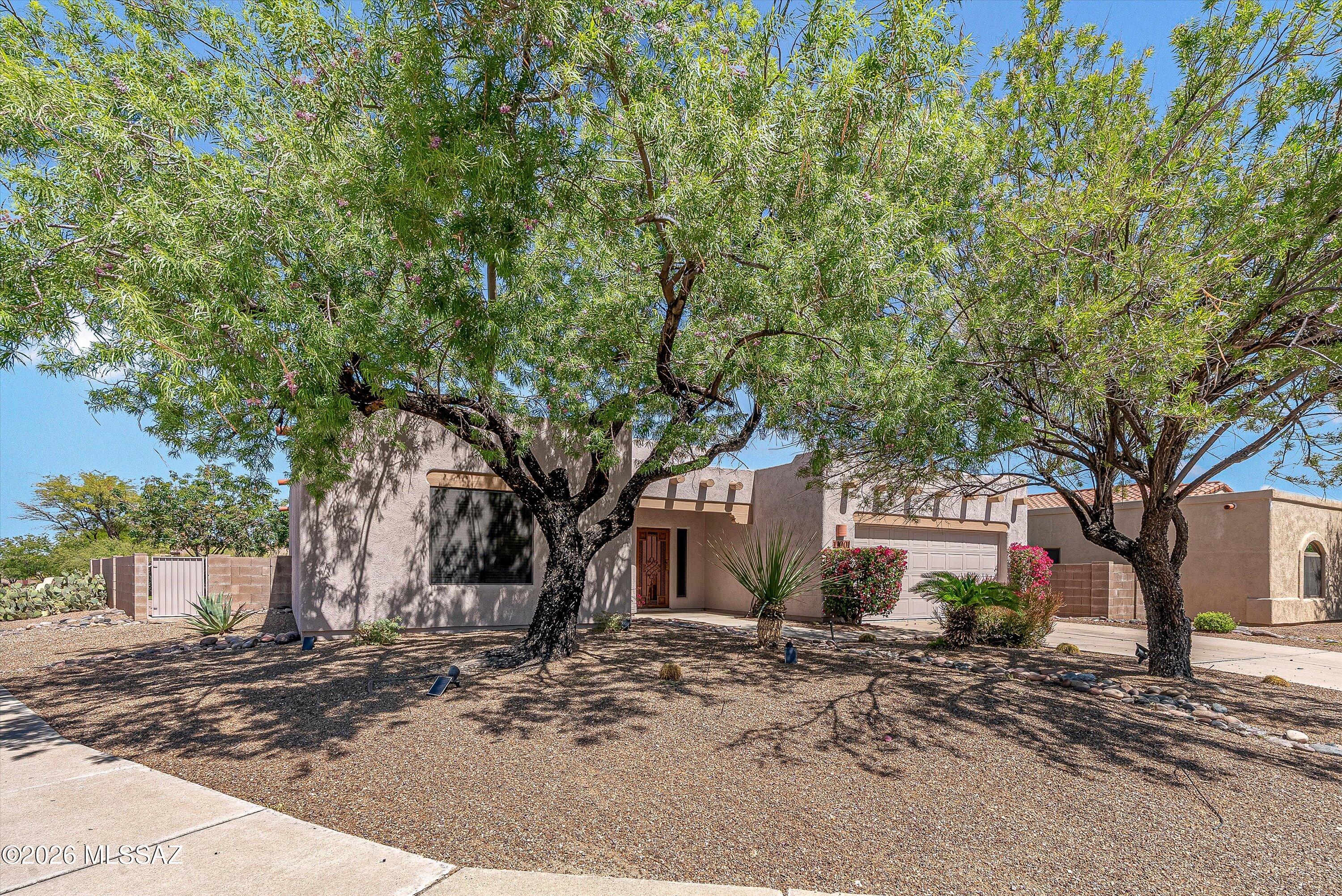 Perched in Tucson's desirable east-side foothills, this beautiful home offers refined desert living with effortless style. Light-filled interiors feature tall ceilings, elegant finishes, & expansive windows that capture stunning mountain & sunset views. The open-concept kitchen is built for both entertaining & everyday ease, while the spacious primary suite provides a spa-like retreat. Private backyard oasis with pool & spa combo invites relaxation with multiple seating areas & serene desert surroundings. Tucked in a quiet cul-de-sac yet close to trails, golf, dining, & shopping--this home delivers privacy, sophistication, & the best of Arizona living.