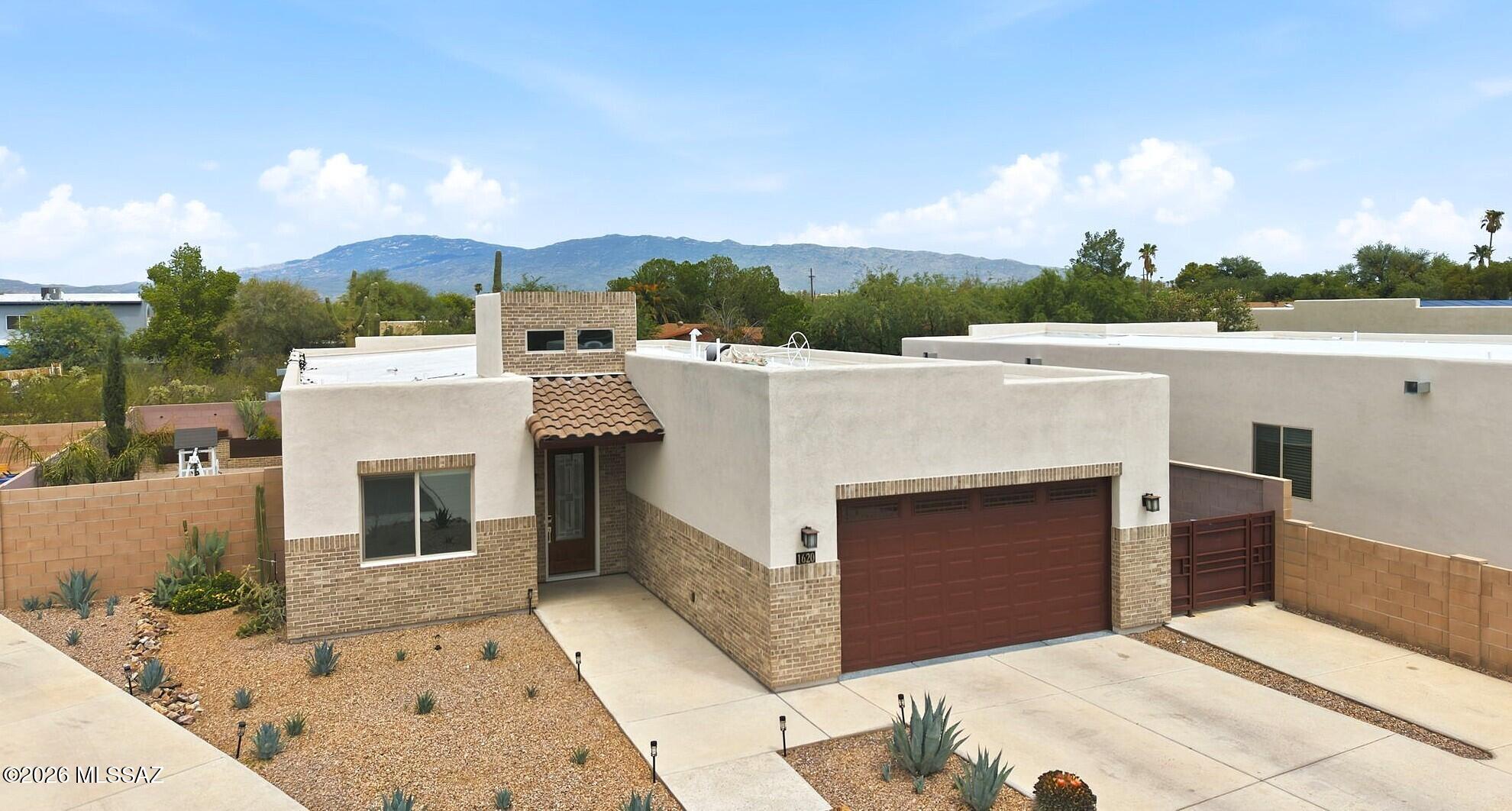 This exceptionally nice home offers a 2211 SF one-story, open floorplan with 4 full BR/3 BA in split plan. New-home style, amenities and finish. Unbeatable NE Tucson location in an enclave of 9 builder-homes from 2020's. Premium selections throughout: high ceilings, recessed lighting, ceramic plank flooring, dark cabinetry and marble countertops. Gourmet kitchen with large island, gas range, stainless appliance suite.  Greatroom opens to covered patio and private wrap-around yard with pavers, custom planters, BBQ.  The custom details have been done! (NO deferred maintenance or old HVAC.)
Close-in, established area of schools, hospitals, shopping, restaurants, parks, Udall recreation, Sabino Canyon, hiking, golf, employers. Seller may consider contribution for Buyer.