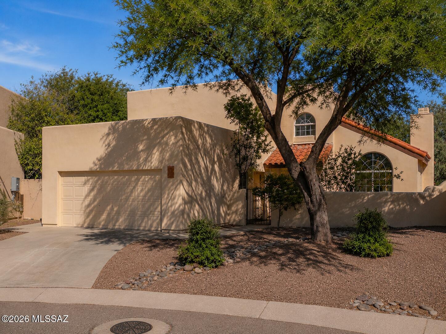Stunning 4BD/3BA fully remodeled two-story home in the heart of Tucson! Step into a bright, open-concept main floor featuring a spacious living room, dining area, kitchen, and great room -- all flowing seamlessly together. Two cozy fireplaces add warmth and character throughout. The chef's kitchen shines with granite countertops, stainless steel appliances, and subway tile backsplash. Upstairs, find four generously sized bedrooms, including a serene primary suite. A dedicated laundry room and two-car garage add everyday convenience. Outside, enjoy a large private backyard with an expansive paver patio, covered pergola, and upper-level balcony -- perfect for entertaining. Every detail thoughtfully updated. Move-in ready!