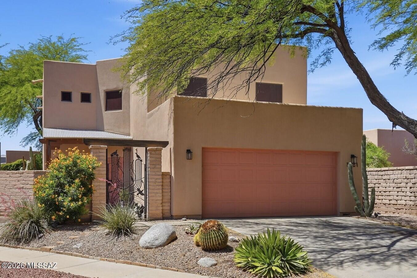 Nestled in the heart of mid-town Tucson, this wonderful, gated enclave is home to just 41 homes. This light-filled home is on the largest lot in the neighborhood and boasts 4 generous bedrooms and 3 full baths. Downstairs you'll  find a comfortable guest bedroom with full bath, family room with soaring ceilings, open kitchen with breakfast bar and large eat-in dining. Step out to the beautifully shaded back yard with artificial turf and low-care landscaping. The first level also includes the laundry closet with newer washer and dryer (included) and a flexible front room for formal dining, a library, music room or...? Continue upstairs to a brightly lit loft, generous primary suite with recently updated bath, two additional bedrooms and another full bath.