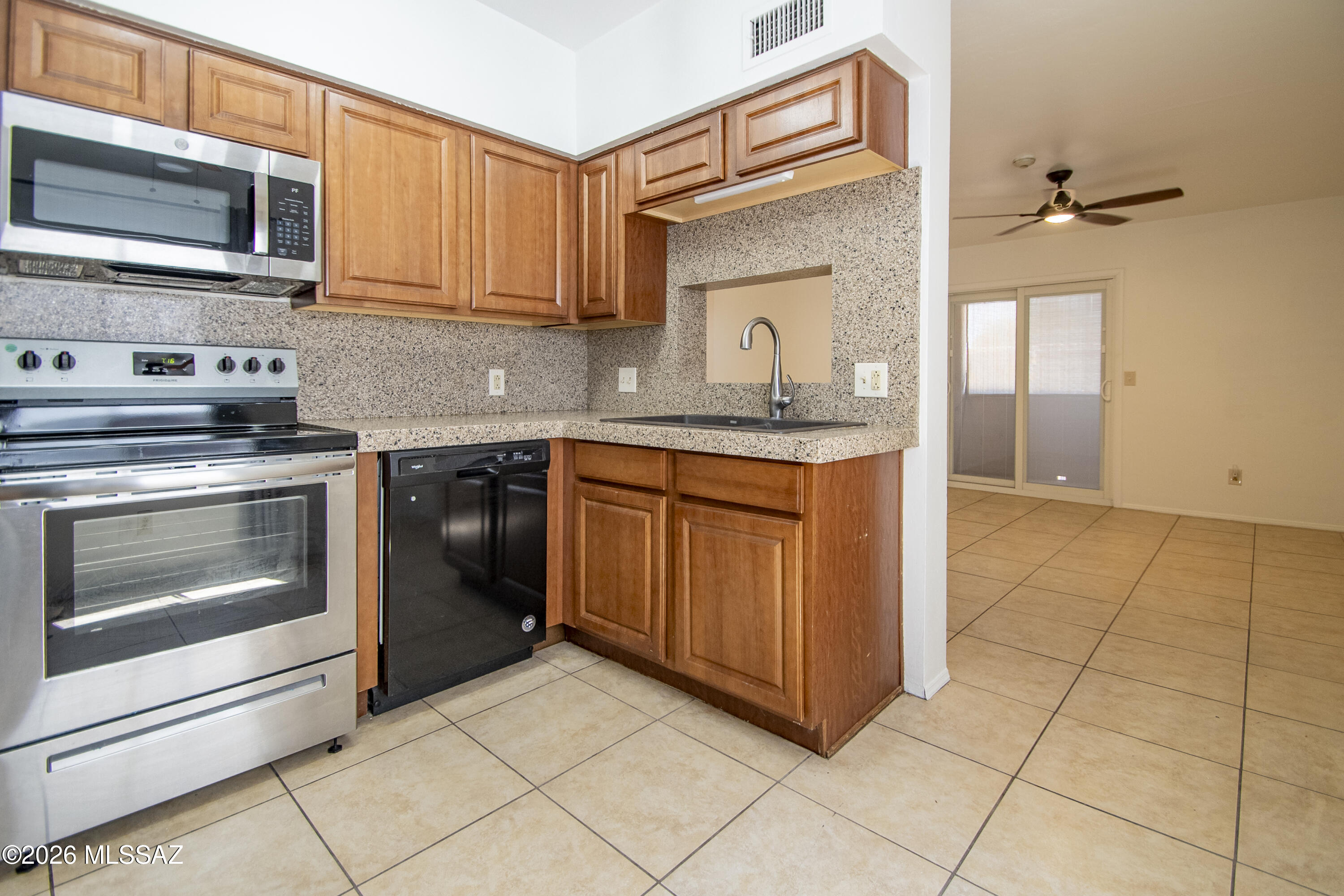 Conveniently located near the University of Arizona, this 2-bedroom, 1-bath end-unit condominium is located on the third floor of Casa Club Condominiums. Enjoy mountain views and close proximity to one of the community pools.
The home features tile flooring throughout the main living areas, with upgraded wood-look laminate flooring in both bedrooms--there is no carpet in the unit. The water heater was installed in 2019, and the appliances have been updated in recent years.
Community amenities include multiple pools and spas, tennis courts, a fitness center, and community laundry facilities. The property is approximately 2 to 2.5 miles from the University of Arizona and offers convenient access to shopping, dining, and everyday amenities.