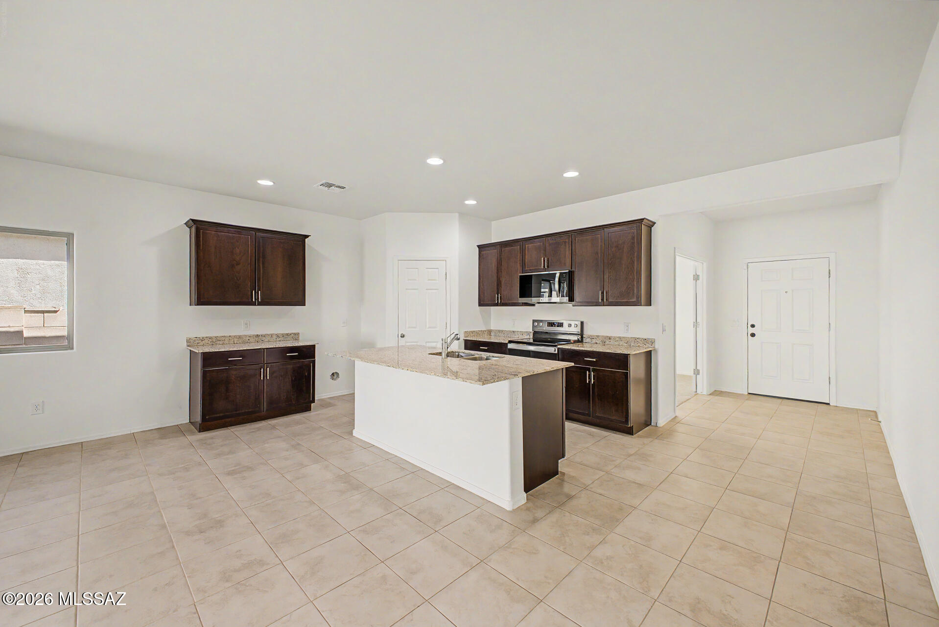 Contemporary gem in Gladden Farms! Built in 2022, this move-in ready home features a bright and airy open floor plan with fresh interior paint and plush new carpet. The spacious layout offers 4 bedrooms, 2 bathrooms, and a versatile den. Enjoy a beautifully landscaped yard with decorative rock, artificial turf, and a covered patio--perfect for relaxing or entertaining. Located in a vibrant community with abundant amenities. Come see this outstanding home today!