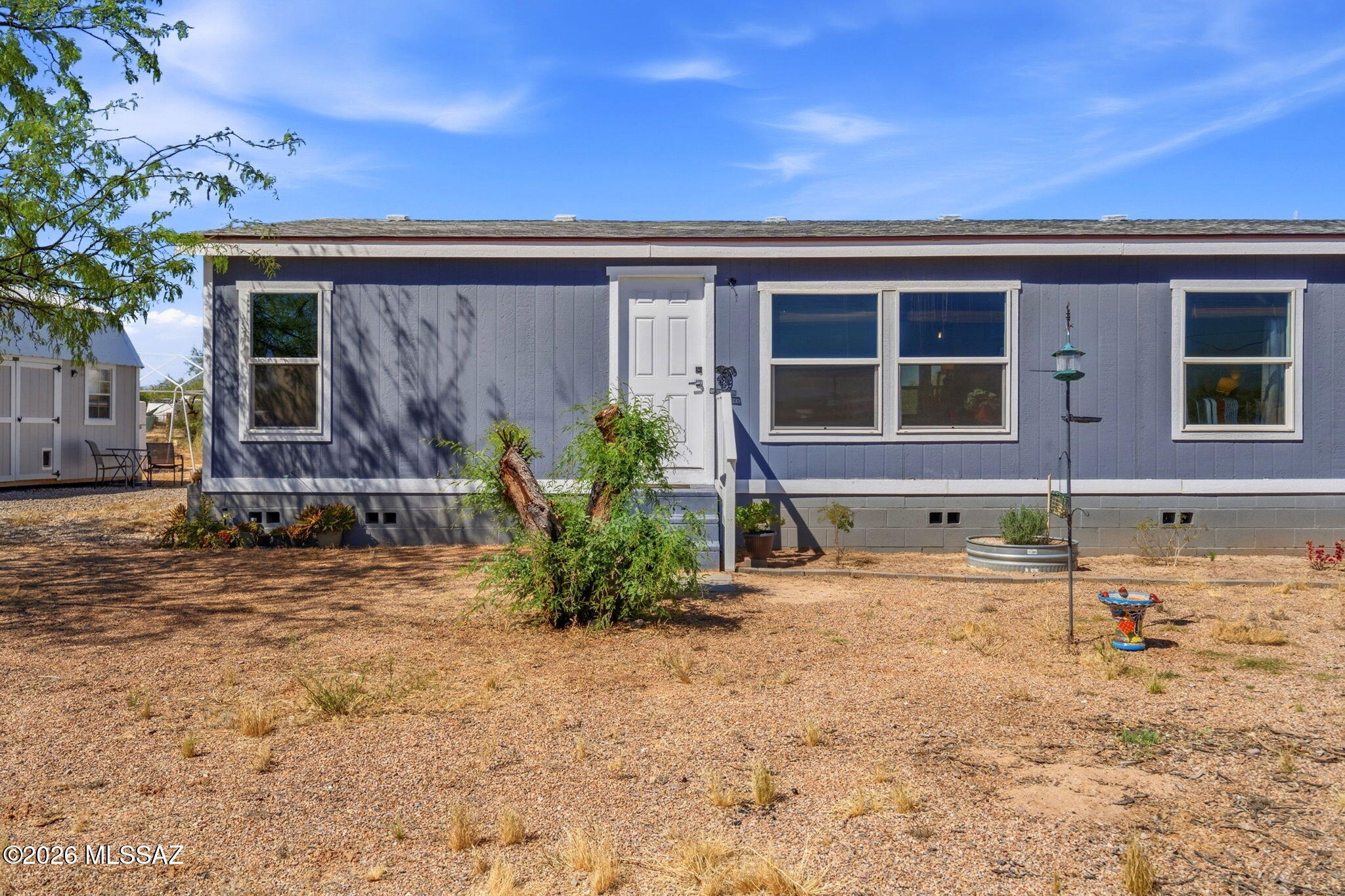 Buyer backed out w/ no inspections.  TWICE! Waiting for a new buyer! This house is CLEAN! Come see this move in ready home that sits on 1 acre and just 35 min from downtown Tucson. Home is  4 bedrooms and 2 bathrooms with a Living room and massive  kitchen. Propane gas stainless steel stove, Stainless refrigerator and huge area for the best family gatherings along the breakfast bar. Primary bathroom is fully upgraded with decorative tile shower, granite counters with dual sinks, and plenty of storage. Fully fenced and gated for your privacy! 10 x 20 Storage Shed that can be converted to a tiny house space with a mini split AC/heat and lighting. There is a 30 amp outlet for an RV hook-up! This is ready for you to move in and start your dreams in the Sonoran Desert!