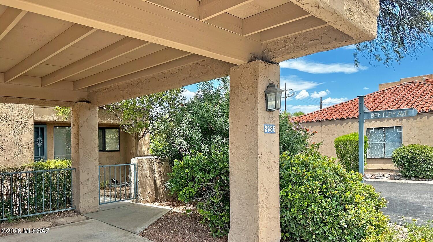 Crepe Myrtle ''tree'' in front courtyard. Rear yard with two patios, one off Primary Suite and one at Great room, both with sliding door access to private rear yard (in direction of Catalinas).  End unit with east facing dining area window - for your morning coffee?  Large stainless kitchen, with nicer appliances including a convection/air-fry range, Bosch quiet-type dishwasher, big fridge with filtered ice/water in the door.  Smartly located a short walk to community pool/spa/BBQ's/clubhouse and mailbox CBU.  2-owners since new.  Recently refreshed 2022-2024 (light finishes, wood-look plank flooring, blinds/shades, appliances)
Beamed volume ceilings in Great Room/Kitchen, 
Ceiling fans and big closets in both spacious bedrooms. Lockable storage room off carport with private EV receptacl