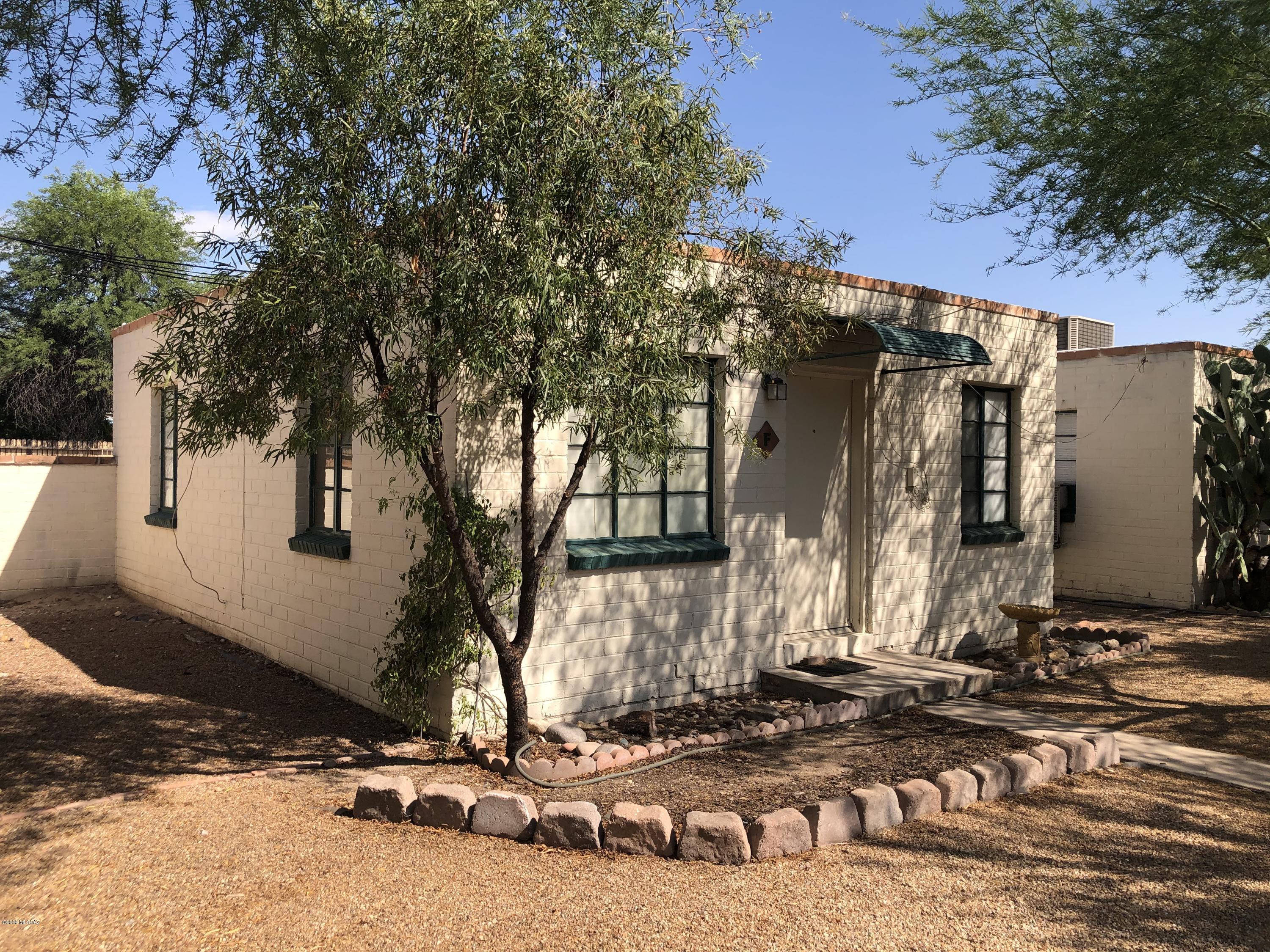 Mid-century 1 Bedroom single family bungalow  in small complex of 9 homes. Community offers front  landscaped, shared central courtyard with 1 designated cover parking. No carpet and central AC! Rent includes water sewer and trash. Great central location near shopping/restaurants. Pets upon owner approval. NO laundry facilities and no enclosed yard.