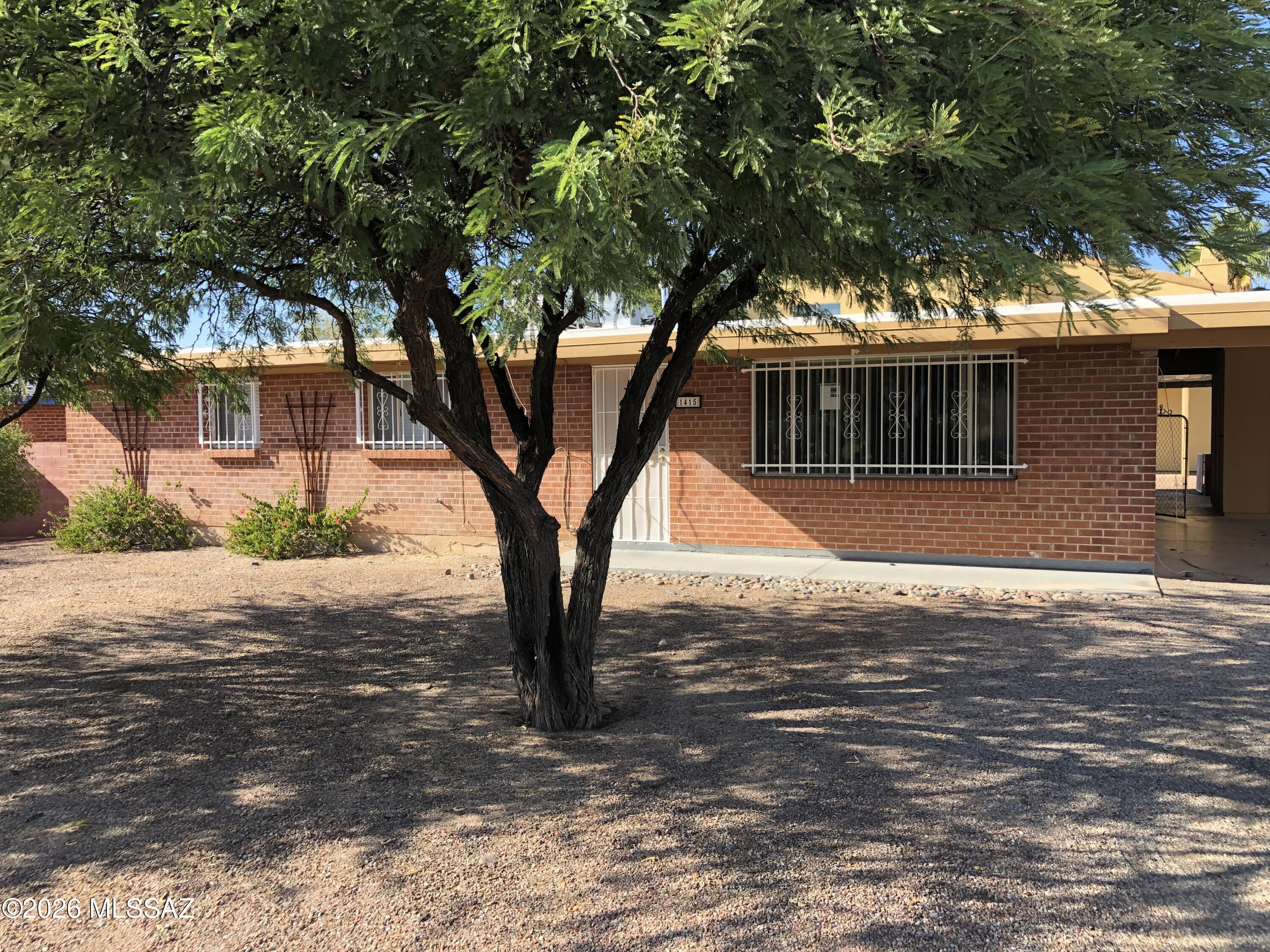 ** AVAILABLE FOR A LEASE START OF AUGUST 2026 **
Don't miss out on this 4 bedroom, 2 bath house available for rent. A/C cooling. Spacious living/dining/den area. Updated granite countertops in kitchen. Hall bath remodeled. Updated ceramic tile flooring in the kitchen and den. Stove, refrigerator, dishwasher, washer & dryer included. Carport with extra storage. Security wrought iron. Free off-street parking. Great location close to U of A and Banner. 4 minutes from campus by car/bike, 15 minute walk. 

Non-refundable cleaning fee: $600 ($150 per tenant)
Tenants pay all utilities. Water usage is billed by Grijalva Realty.
Sorry, no pets allowed. 
Currently occupied. Do not disturb tenants.