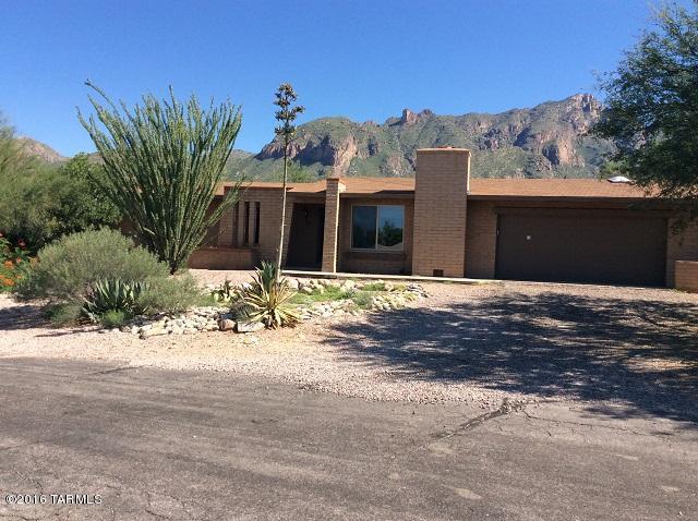 This home is full of charm and has lots of love to give to you.  The spacious living area is bright and features a cozy fireplace for the cool winter nights. You will enjoy entertaining and cooking in your gourmet kitchen. This is a split bedroom floorplan with a large workshop attached that sits on great desert land with amazing views of the mountains. Many years will be enjoyed in this home with family, hurry before it’s gone.     The refrigerator is included. This home can be rented for 12 months or longer.