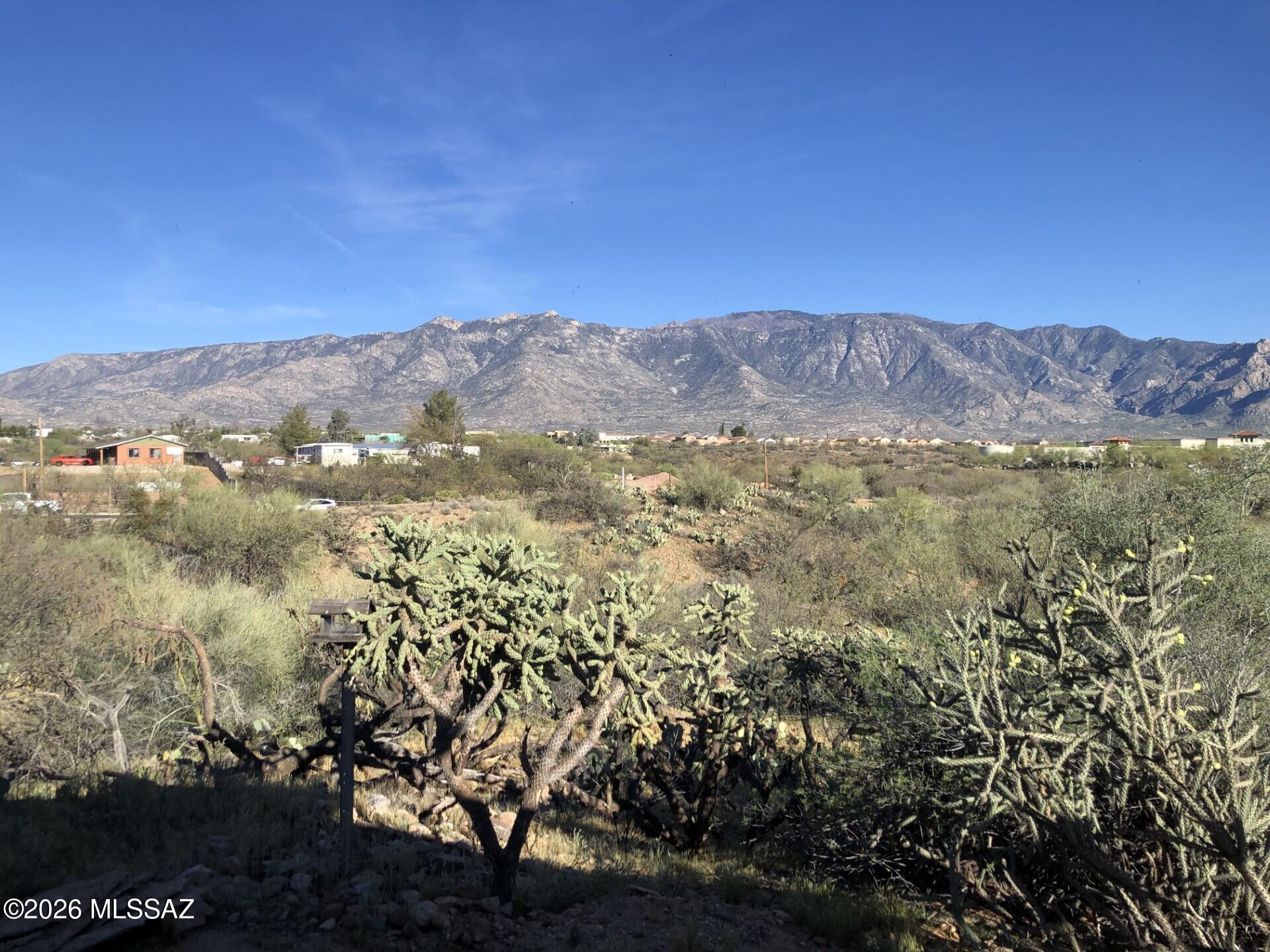 Welcome to an exceptional desert retreat at 15445 N Oracle Road in Tucson, where opportunity flexibility, and breathtaking scenery come together on 1.125 acres with stunning, unobstructed views of the majestic Santa Catalina Mountains.
   This unique property features two fully upgraded manufactured homes, each offering 3 bedrooms and 2 bathrooms, making it ideal for multi-generational living, rental income, guest accommodations, or a private family compound with room to spread out and enjoy the beauty of Southern Arizona. The spacious double-wide home provides comfortable, open-concept living with abundant natural light and panoramic mountain vistas, while the charming single-wide home offers its own welcoming layout. and equally impressive views. Both residences have been thoughtfully updated and are completely move-in ready, allowing you to immediately enjoy the property or begin generating income potential. One of the property's standout features is the convenience and independence of each home being separately metered for electric, gas, and water, creating exceptional flexibility for owners and tenants alike. The double wide is ground set and has a level entry with no worry of having to climb steps, perfect for those of us that have challenges navigating stairs.  With over an acre of land, there is ample space for outdoor entertaining, RV parking, gardening, recreational vehicles, or simply enjoying the peaceful desert surroundings and spectacular Arizona sunsets. Whether you are seeking an investment opportunity, a dual-living setup, or a serene retreat with endless possibilities, this property delivers rare versatility in a highly desirable North Tucson location.
Experience the perfect blend of privacy, functionality, and unforgettable mountain views at 15445 N Oracle Road -- a truly special property ready for its next chapter. There is easy access from Thistle 1st driveway to the north 3rd home on the right.