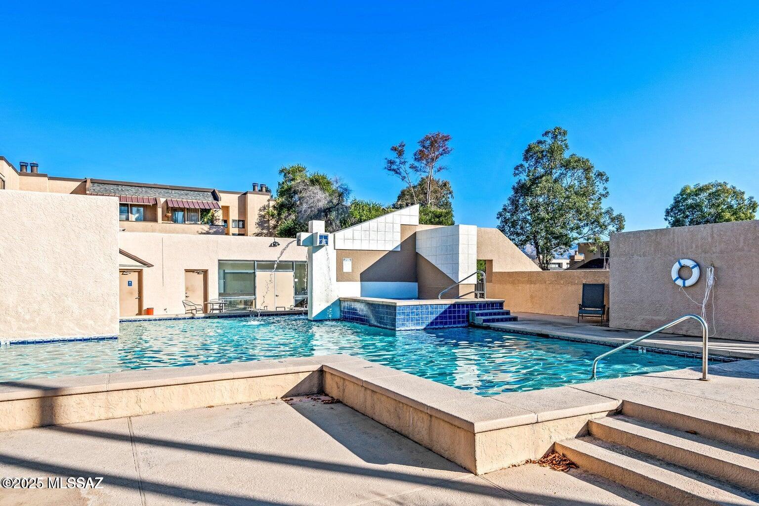 Move-in ready! Great for students, seasonal living, vacation rental. Close to Udall Park, Mount Lemon, Sabino Canyon & more. Enjoy the quiet that comes w/ being located at the back of community. Responsive HOA provides excellent value, covering water, trash, termites, pool, exterior paint, & roof. 2BR/2BA contemporary condo with private gated courtyard and covered parking just steps away from entry. Well-maintained w/ neutral finishes, consistent flooring,  high ceilings & new picture window allowing for natural light. Updated kitchen includes ample cabinetry & opens to the living area. Spacious primary bedroom w/ walk in closet. Second bedroom opens to patio & has great closet space. Private patio is perfect for relaxing.