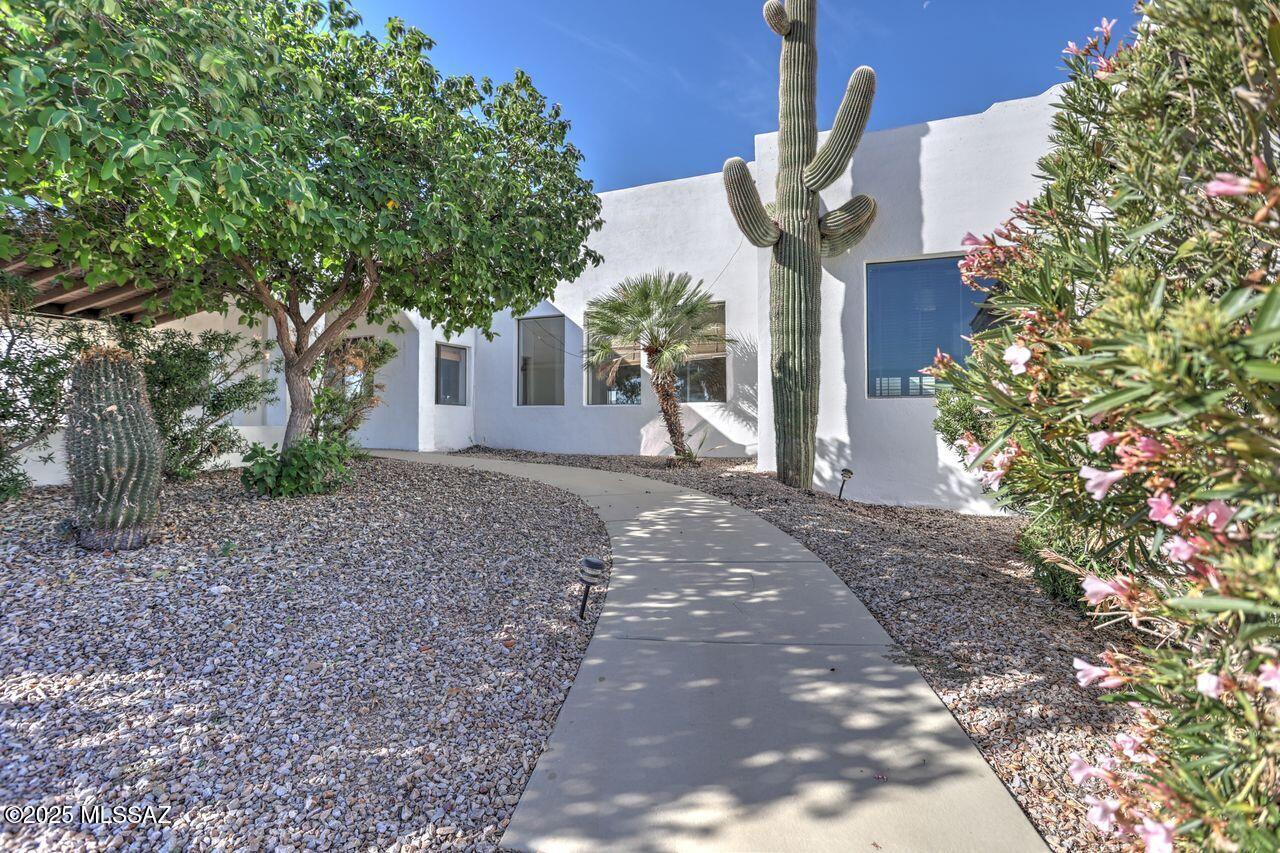 Check out the price per square foot on this  Private Gorgeous hilltop home with panoramic views!   Every square foot of this 5328 sq ft home is beautiful, w/marble floors, granite counters, interior pillars and Spacious Rooms.  Four bedrooms, three of those are huge primary ensuite bedrooms, two with large custom walk-in showers and separate tubs. Two front entrances into home, one into a large foyer, and one from the beautiful covered patio.  The 3000 sq ft detached garage built in 2016 with three 12'  x 14' garage doors is every car enthusiast, builder or mechanics dream garage, with 200 AMP electric, water, Evaporative cooling AND Heat Pump for AC/Heat. Room for 10 cars, or even RV's and cars. Extensive remodeling on house was completed a few years ago, and has been maintained well. Extensive remodeling on house was completed a few years ago, and has been maintained well.