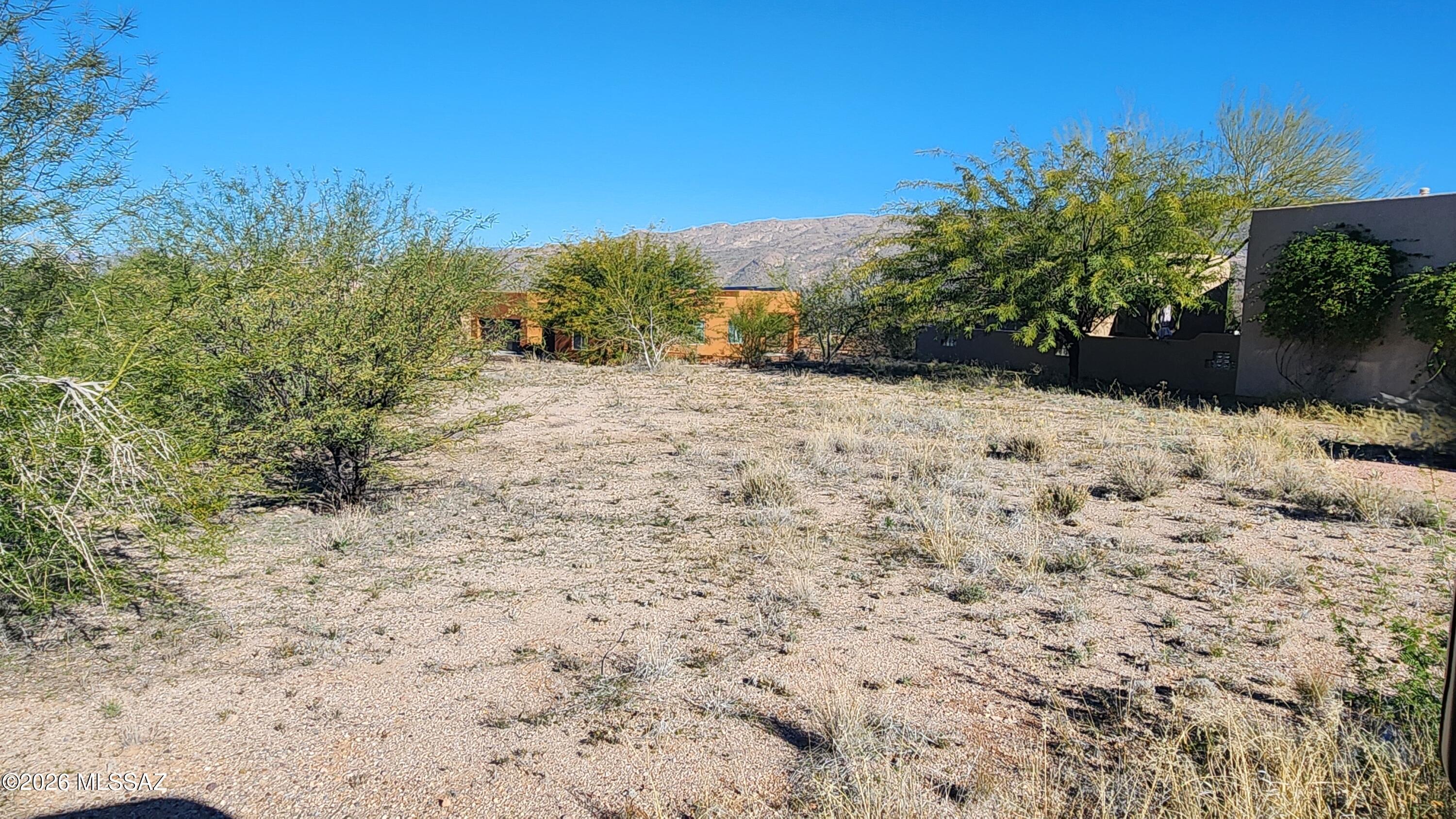 This elevated lot has partial Rincon Mountain views and has utilities at the street.  This is a 55+ development.