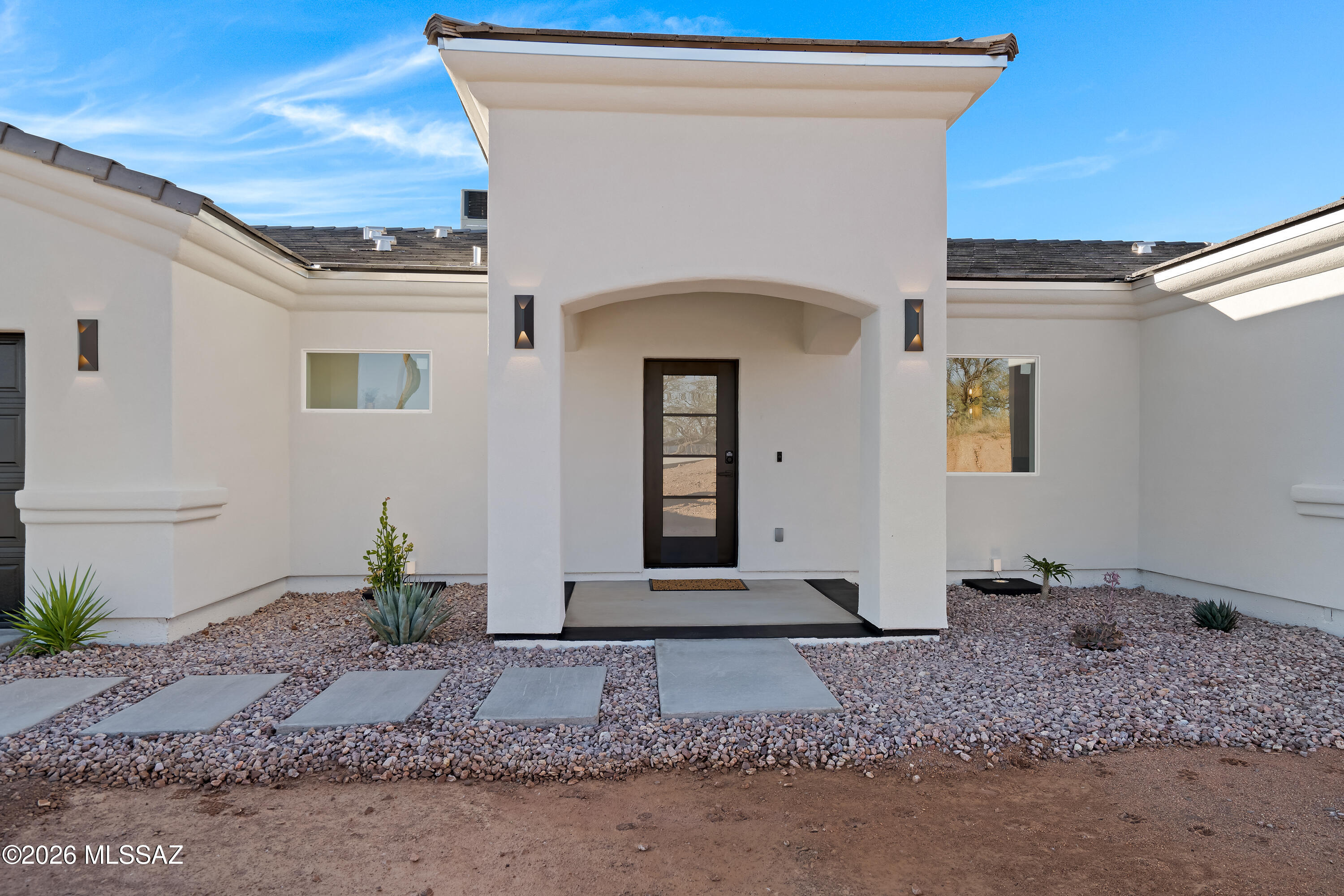 Built by the trusted Dream House Builders, this exceptional new construction home showcases superior craftsmanship and thoughtful design throughout. Constructed with durable 2×6 framing and finished with synthetic stucco, this residence offers lasting quality and curb appeal. Inside, soaring 10-foot ceilings create a bright, open atmosphere complemented by premium finishes at every turn. The handcrafted kitchen serves as the heart of the home, while the striking fireplace adds warmth and character to the inviting living space. Luxurious full tile showers elevate the bathrooms with a spa-like feel. Situated on a spacious 0.75-acre lot, this property offers endless possibilities to create your dream outdoor retreat while enjoying the quality and attention to detail.