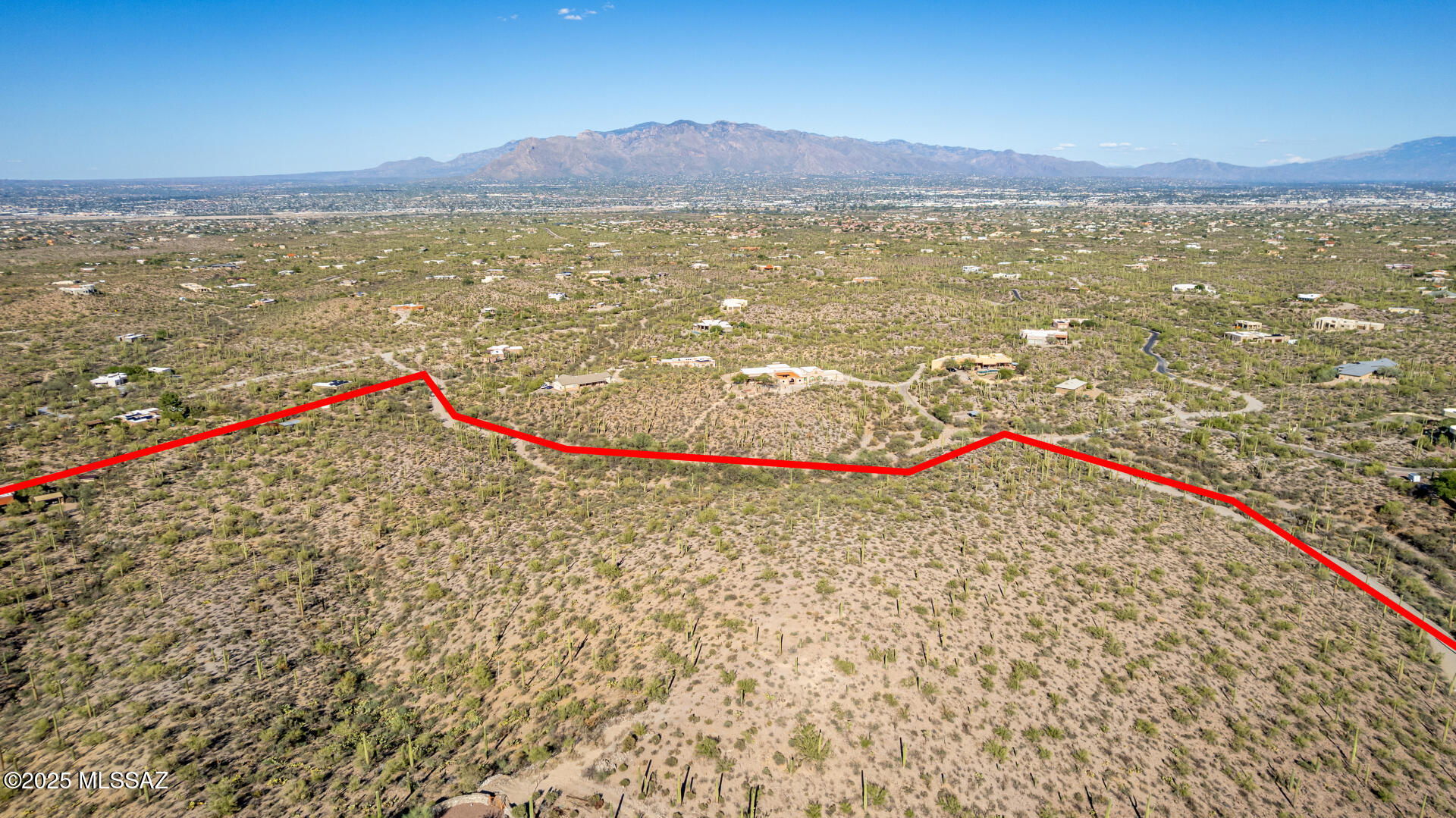 Set within one of Tucson's most exclusive desert enclaves, this 10.53-acre parcel offers a rare blend of privacy, infrastructure, and sweeping Sonoran views. Zoned Suburban Ranch and eligible for a 3-lot split, the property is ideal for a custom estate compound or boutique development. Utilities are already in place, with electric, gas, and telecom at the road and City of Tucson water accessible on site. Surrounded by state land, open space, and the Sweetwater Preserve trail system, the setting delivers both seclusion and convenience. Proposed 3-lot survey available. Easy private road access. Owner carry available.