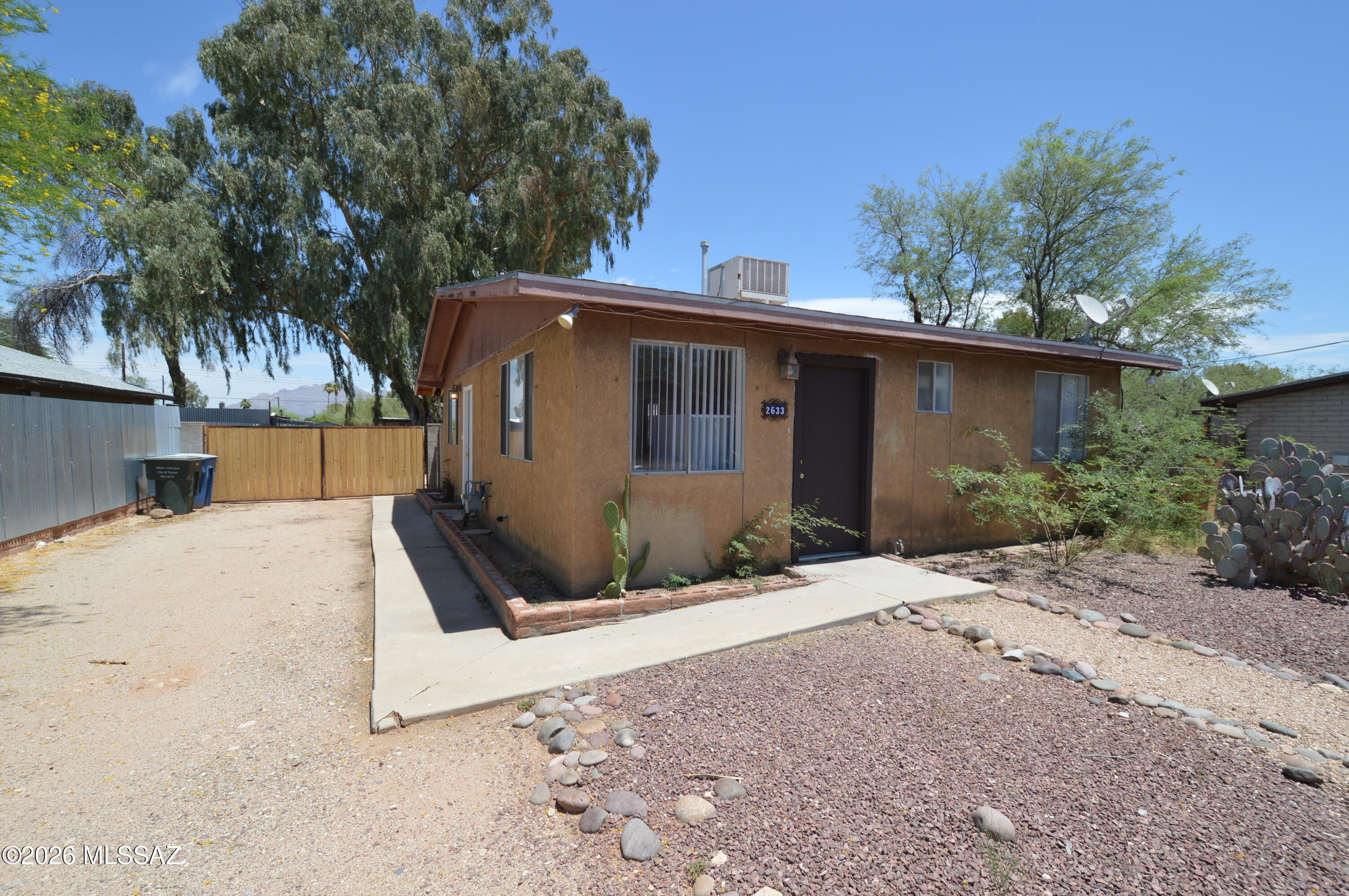 This beautiful 2/2 home is centrally located and close to everything including U of A, and UA Medical Center! Located in desirable Blenman school district. Eat-in kitchen, ceramic tile in the living room, large gated yard, and free standing storage shed! Get a lot for a little, Snag this deal before someone else does! SEE THIS ONE TODAY!