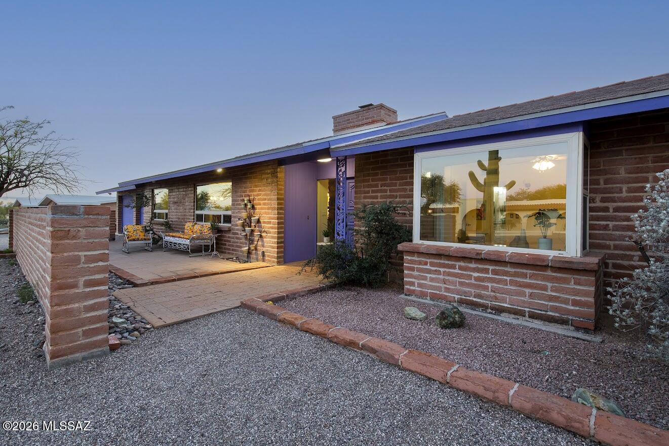 Your next home?!  Come see. Sunsets will be yours every night from the back porches and pool. Spacious home on a large lot in the Foothills features stunning kitchen remodel with a huge custom wood island, custom soft-close cabinetry, SS appliances, built-in wine fridge... a kitchen designed for entertaining! Wood-burning double sided fireplace makes a cozy focal point for both living room areas. Interior of home is freshly painted. Bathrooms are both remodeled; this home is beautifully maintained & move-in ready. Two car garage has storage room; laundry room opens to backyard and garage. No HOA rules, so bring your RV! The two back porches span the entire home, and the property extends beyond the back wall with natural desert.  Completely reroofed in 2025... Monsoon proof!