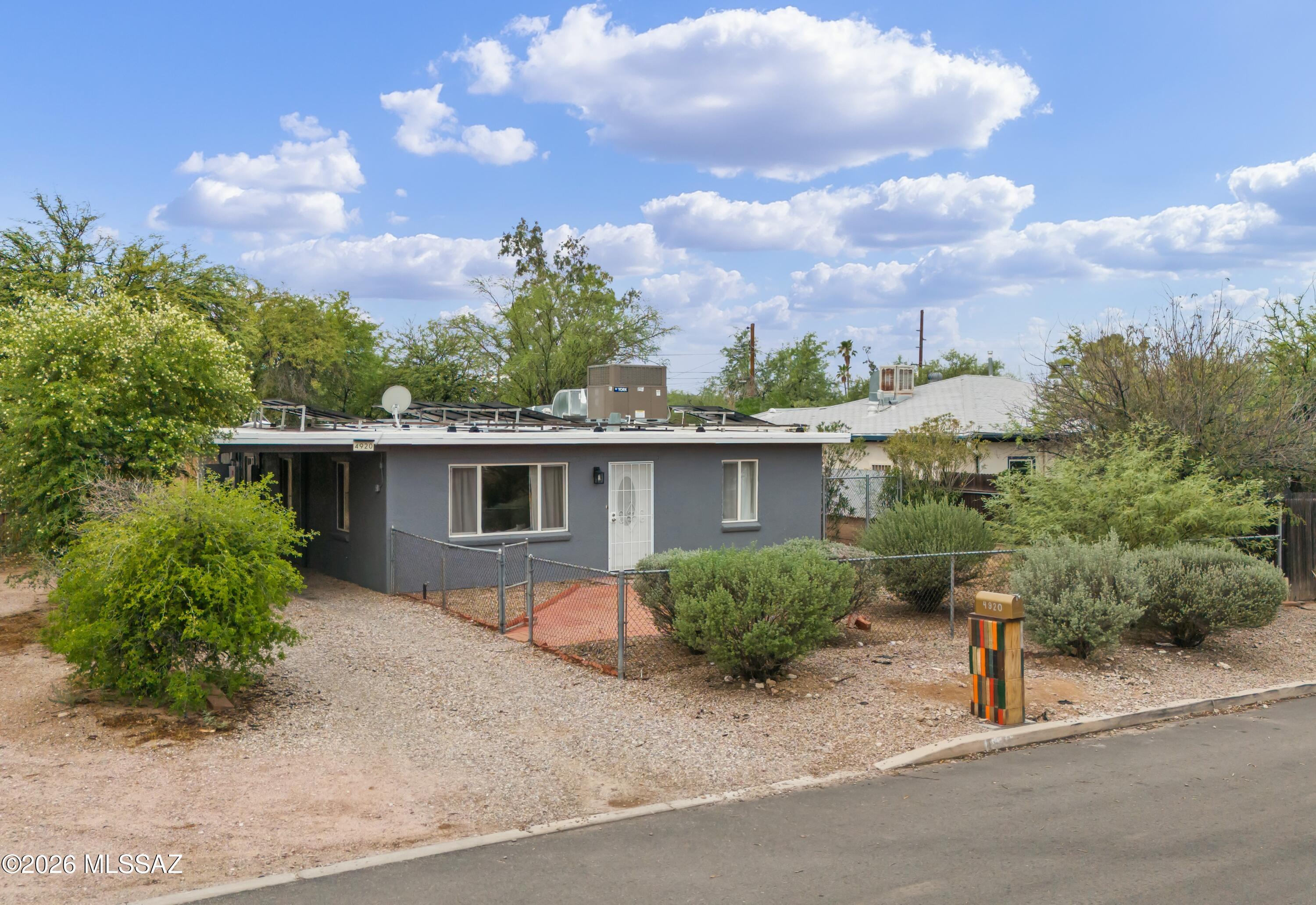 From the moment you step through the front door, this central gem welcomes you with the warmth of the perfect starter home! Inside, the beautifully updated kitchen is ready for taco nights and easy hosting. Three cozy bedrooms keep you cool with ceiling fans and energy-efficient dual-pane windows. The real fun is in the massive backyard. A vibrant, low-maintenance turf yard is perfect for weekend BBQs, plus a handy shed keeps your gear tucked away. Best of all? There is no HOA, giving you total freedom. You also get instant energy savings with an active solar system for just $155 p/month plus the standard TEP fee. With indoor comfort, outdoor fun, and an unbeatable location, it's a rare find for a first home!