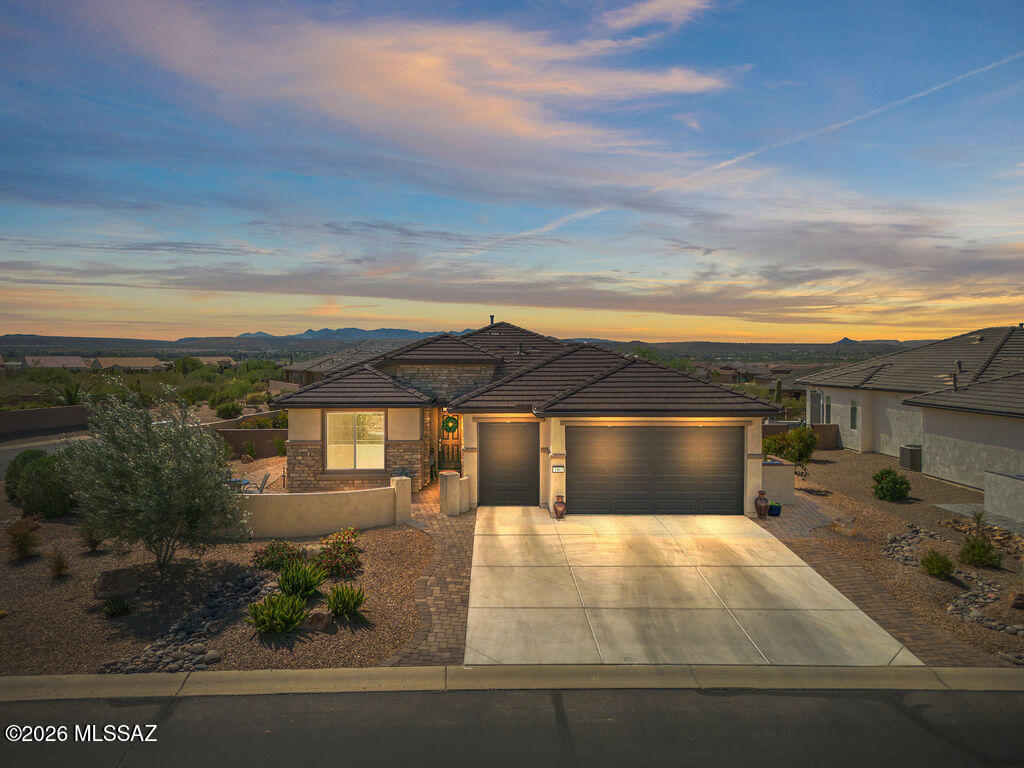 Welcome to resort-style living in the highly sought-after active adult community of Quail Creek, where luxury, comfort, and lifestyle come together seamlessly. Situated on a premium corner lot with no rear neighbors, this home offers breathtaking sunset views and ultimate privacy. The fully enclosed backyard is designed for both relaxation and entertaining, featuring motorized patio shades, an outdoor TV mount, a gas hookup for your grill, and an expansive paver patio that wraps around to a charming courtyard--perfect for enjoying Arizona's beautiful weather year-round. Step inside to an open-concept layout filled with natural light, enhanced by 9' and 11' ceilings and grand 8' interior doors throughout. The kitchen is a true highlight, featuring a bay window, elegant quartz countertops, undermount cabinet lighting, and a KIND water softener with ultraviolet filtration system for added quality and peace of mind.
The thoughtfully designed split floorplan offers privacy and functionality. A versatile den with built-in cabinets and desk creates the perfect home office or flex space. The laundry room is loaded with additional storage, and you'll appreciate the abundance of closets throughout the home. Car enthusiasts and hobbyists will love the extended 3-car garage, including a dedicated golf cart garage--ideal for enjoying everything the community has to offer. Living in Quail Creek means access to world-class amenities, including a championship golf course, resort-style pools, state-of-the-art fitness center, tennis and pickleball courts, clubhouse dining, walking trails, and a full calendar of social activities and events--all designed to support an active and vibrant lifestyle. This is more than a home--it's a lifestyle. Come experience the best of Quail Creek living.