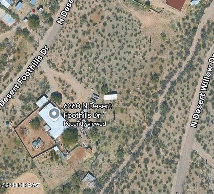 Discover the possibilities with this well-built home on a spacious 3.9-acre lot on Tucson's desirable West Side. The property features a 3-bedroom, 2-bath main residence plus attached 1-bedroom, 1-bath guest quarters, each with its own kitchen and living area--ideal for multigenerational living, guests, or rental potential. Step outside to a large backyard with a covered patio, a fenced area perfect for horses, chickens, or recreational vehicles, and plenty of room to create your dream outdoor space. An owned solar system helps keep energy costs low while adding long-term value. Take in breathtaking 360-degree views of the Tucson Mountains, sparkling city lights, and the stunning Catalina Mountains from this unique desert retreat. With acreage, flexibility, and incredible scenery, this.... .... property is ready for your vision.
