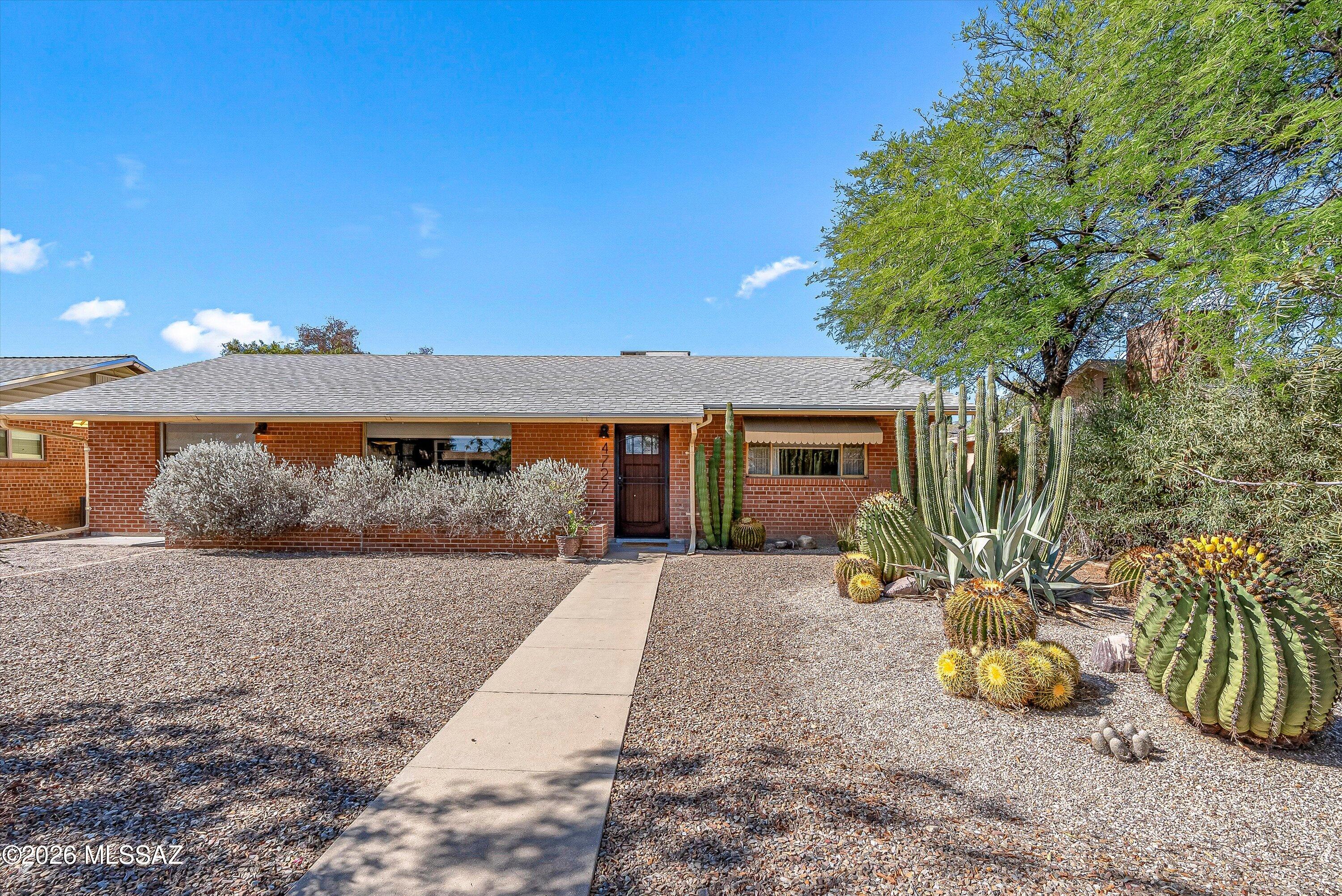 Check out the curb appeal on this centrally located beauty! You will feel at home the moment you walk in the door with a nice open concept main living and dining area with a large picture window that showcases the natural light. Along with a well thought out kitchen design that offers an abundance of cabinetry, plenty of counter space, a new cook top (2026) and newer fridge. (2023). Wood floors throughout and carpet in all the right places. Continue on into the spacious bonus room with T & G wood ceiling where the options for use are endless. As you step outside to explore the incredible outdoor space you will enjoy relaxing on your generous patio and covered porch. BUT WAIT, this incredible home has more! A NEW ROOF and fascia replacement, a covered carport in the back area and a newer shed for extra storage. Pride of ownership shows!
