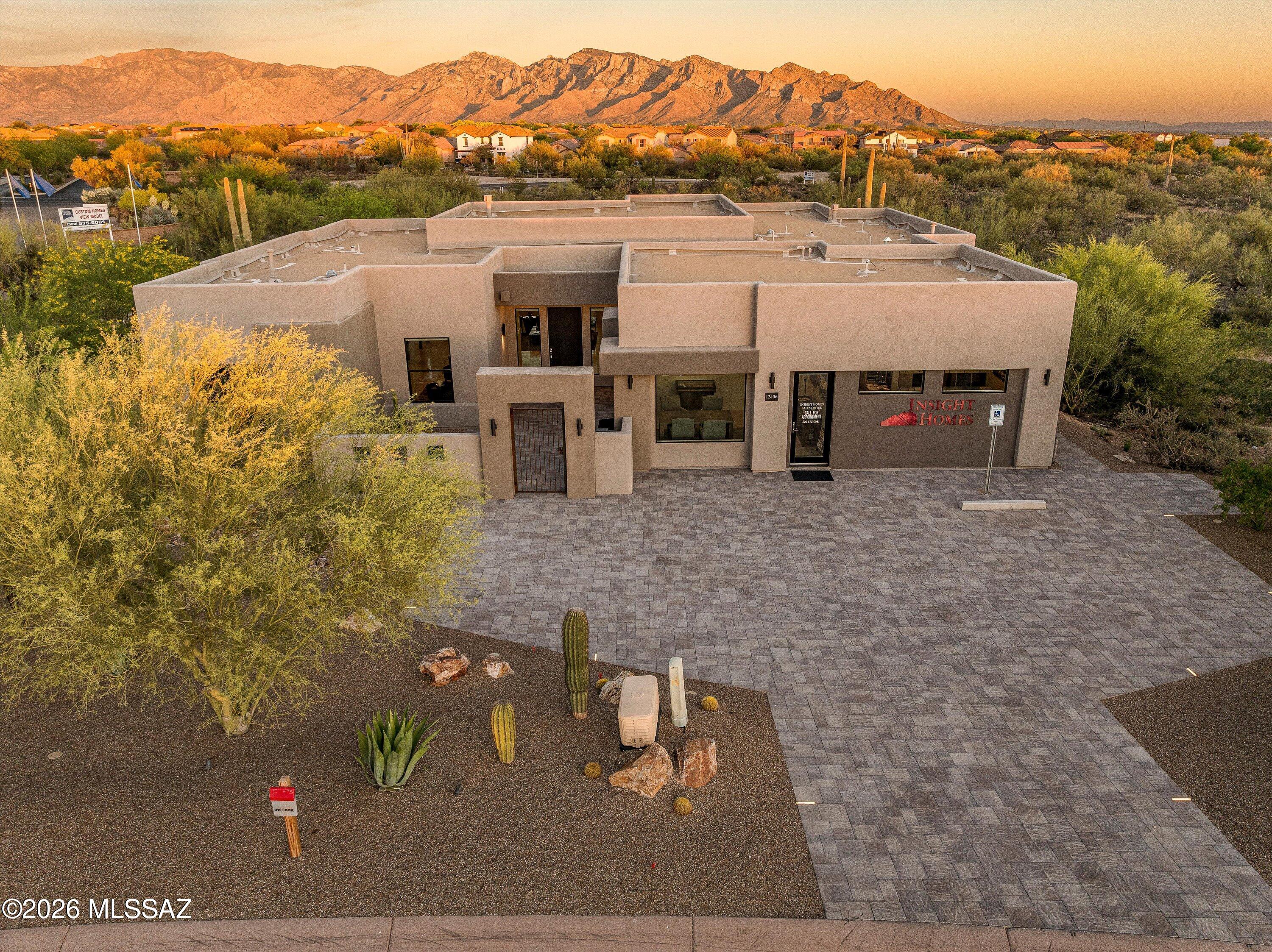 Welcome to luxury living in Tortolita Vistas, a private gated community in Tucson. This exquisite Insight Homes model home showcases the ''Tucson'' floorplan, a masterpiece of design and craftsmanship. The expanded primary suite is a private retreat with a 2-sided fireplace and soaking tub. A gourmet kitchen awaits with a butler's pantry and oversized island. Entertain guests with a wet bar and a stunning 42'' stacked stone fireplace.

High-end finishes include 2'x4' porcelain tile, T&G ceilings, and custom knotty alder doors. Outside, enjoy a fully landscaped oasis with a custom swimming pool. This prime location is minutes from shopping. A 1-year builder leaseback is required. The sales office will be converted into a 3-car garage at the lease's end. A full list of upgrades is availabl
