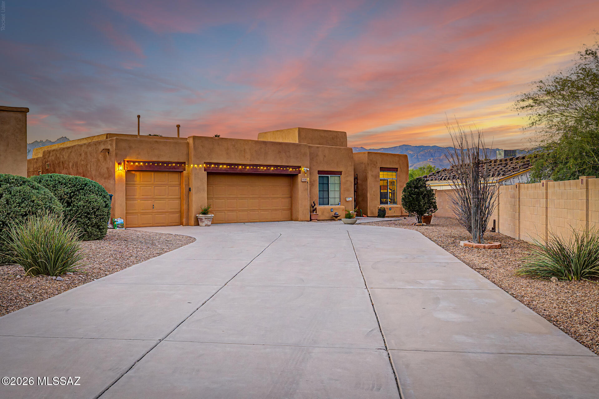 Welcome to an entertainer's dream tucked away at the end of a quiet cul-de-sac! This stunning home offers an incredible garage setup with space for up to five vehicles, four bays across plus a tandem garage with direct access to the backyard. Inside, you'll find a spacious and versatile split bedroom floor plan featuring 3 bedrooms, a den, a great room, formal living room, dining room, and 2.5 bathrooms. The oversized kitchen island serves as the heart of the home, perfect for gathering with family and friends, while the cozy electric fireplace creates a warm and inviting atmosphere. Architectural details and custom touches set this home apart, including beautiful Mexican tile accents, charming arches, soaring ceilings, and generous walk-in closets. Large windows frame breathtaking mountain views, and manual porch shades provide comfort and privacy when desired. Step outside to a low-maintenance desert oasis complete with a spa, no rear neighbors, and plenty of space to relax or entertain while enjoying Arizona's spectacular sunsets. Combining character, functionality, and privacy, this exceptional home offers a lifestyle that's hard to find.