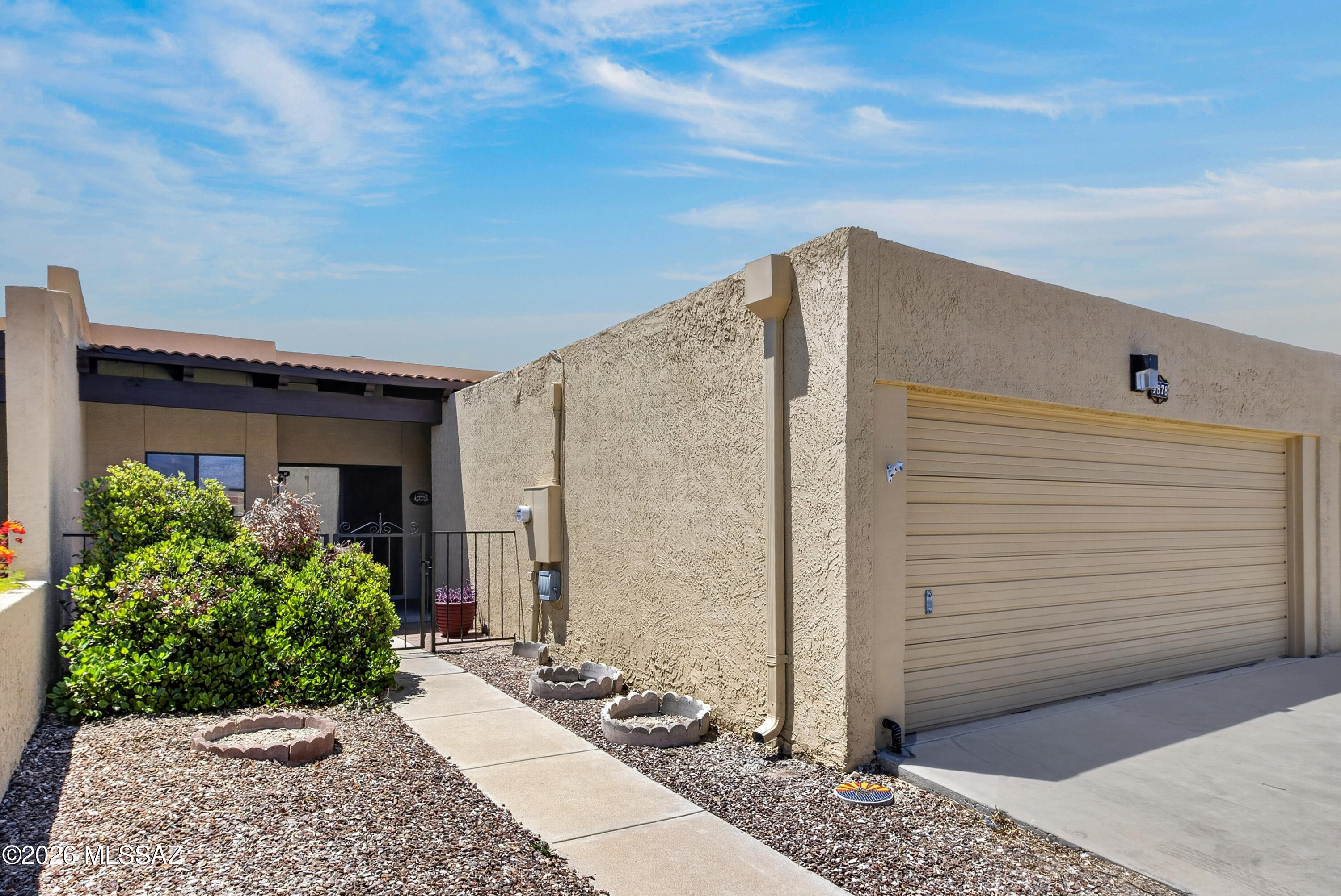 Welcome to 9878 E 1st Street in Tucson, AZ! This beautifully updated 2-bedroom, 2-bath home combines comfort, style, and convenience. Step inside to discover fresh paint and brand-new carpet throughout, creating a bright and inviting atmosphere. The recently updated kitchen offers a modern touch, while spacious bedroom closets provide ample storage. A 2-car garage adds everyday convenience, and residents can enjoy access to the community pool perfect for relaxing Arizona days. Ideally located near shopping, dining, and everyday amenities, this move-in-ready home is ready for its next owner.  A/C unit is 3 years old with a 7 year transferable warranty.  Beehive fireplace and great natural light.  HOA covers water, water service line, exterior paint, common area, pool, spa, and clubhouse!