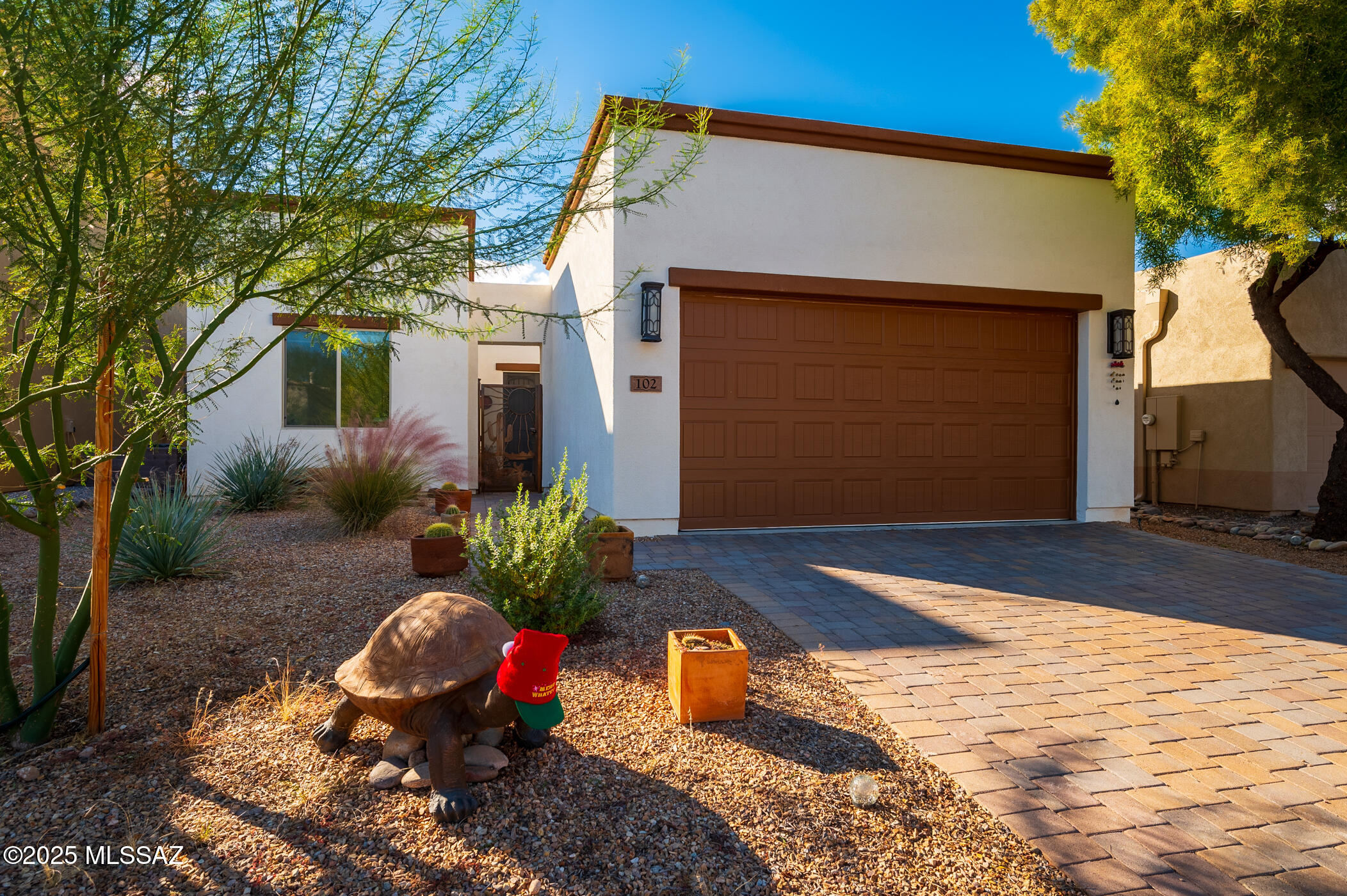Nestled in the Trails Head subdivision of the Barrio de Tubac, this newly constructed 2-bedroom, 2-bath home features numerous upgrades, including an owned 7.20 kWp solar system installed in May 2025.  Tile flooring throughout, a Kinetico water-softening system with reverse osmosis, and a Sun-Control retractable shade over the back porch add comfort and efficiency.  A versatile bonus room is ideal for a home office or media room, and the private walled backyard--just steps from the Anza National Historic Trail--provides a perfect outdoor space for pets and entertaining.  A must-see!