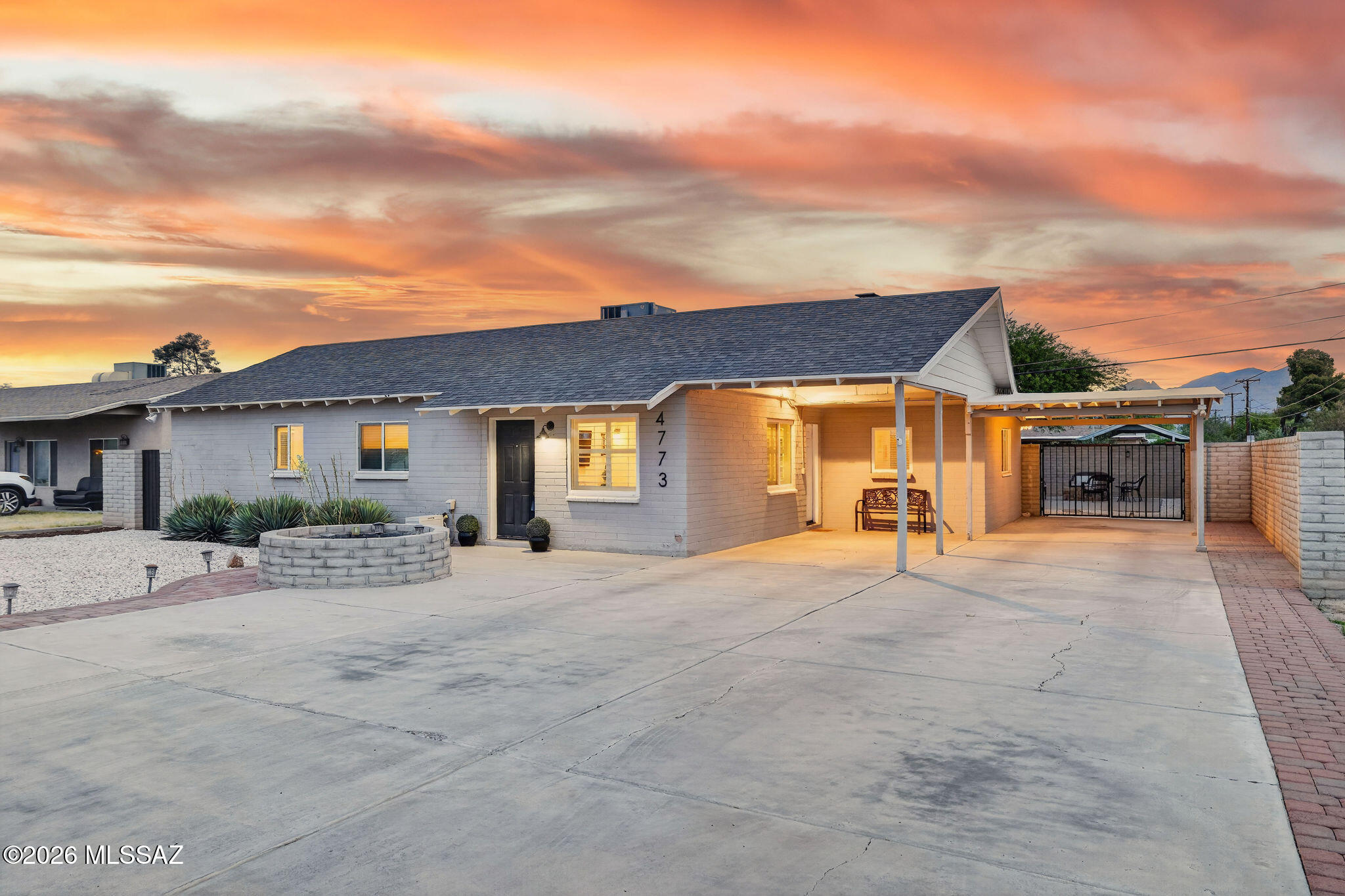 Beautifully updated and centrally located, this move in ready home blends modern design with comfort, functionality, and Arizona outdoor living! From the moment you arrive, the freshly painted exterior, expansive driveway, and gated covered parking create impressive curb appeal with plenty of room for guests, toys, or multi vehicle parking!
Inside, you are welcomed by an open concept layout filled with natural light, wood look tile flooring, recessed lighting, and stylish finishes throughout. The remodeled kitchen serves as the heart of the home, featuring quartz countertops, shaker cabinetry, stainless steel appliances, custom backsplash, oversized breakfast bar seating, and designer industrial inspired lighting that adds warmth and character!

The spacious living and dining areas flow seamlessly for both everyday living and entertaining, while the generously sized primary suite offers a peaceful retreat with additional flex space ideal for a sitting area, office, nursery, or workout space! Stylish bathroom appointments that showcase modern vanities, upgraded fixtures, and clean contemporary finishes!

Step outside to your private backyard oasis complete with low maintenance landscaping, artificial turf, covered patio seating, and plenty of space to relax, entertain, or enjoy Tucson sunsets year round. The fully walled yard offers both privacy and functionality with additional gated access and storage potential.

Conveniently located near shopping, dining, schools, parks, and major commuting routes, this thoughtfully updated home delivers the perfect combination of style, comfort, and central Tucson convenience!

Schedule your private showing today and come see everything this beautifully updated home has to offer.