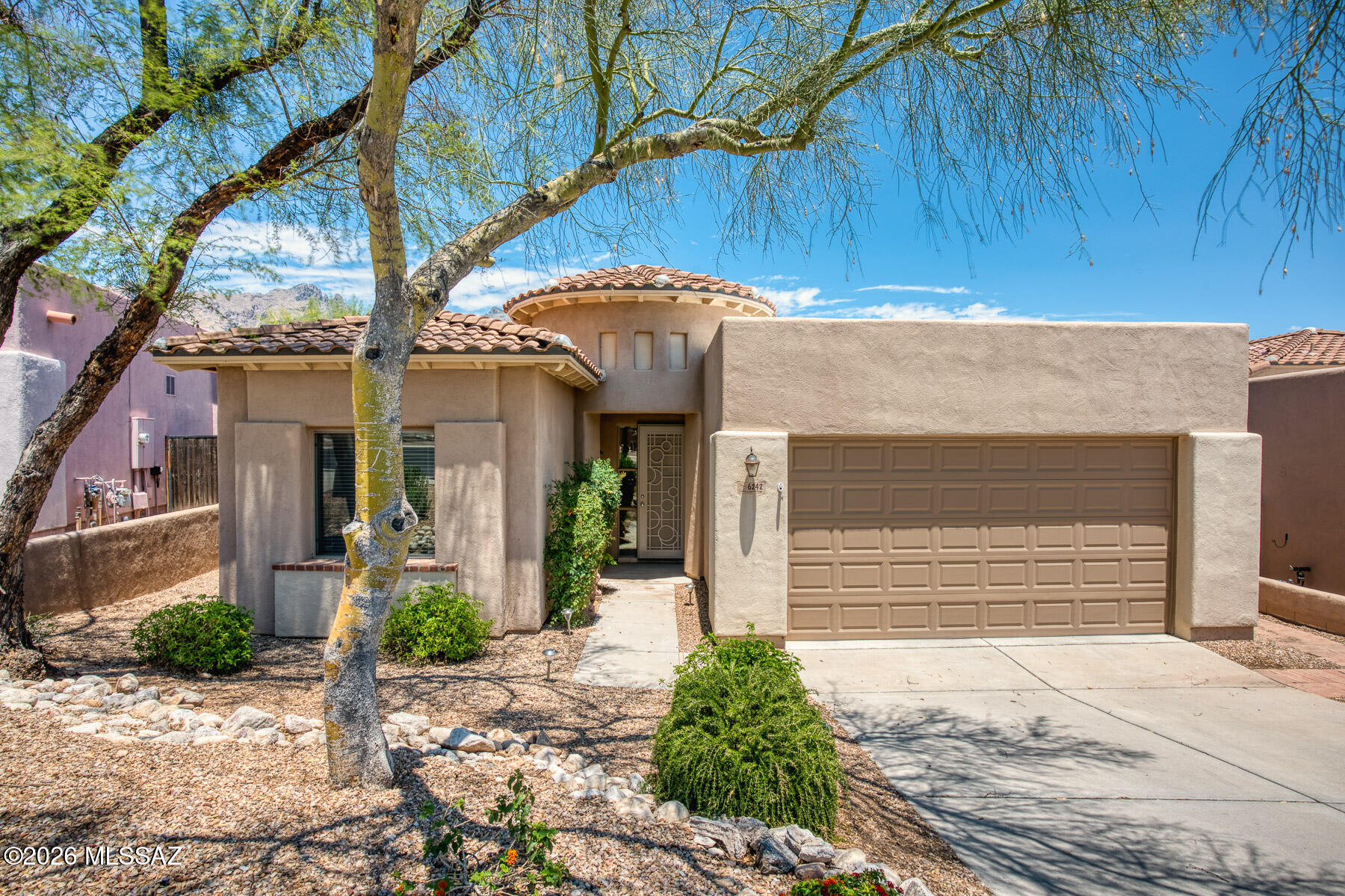 Beautiful 4-bedroom, 2-bath home in the prestigious guard-gated La Paloma community. Situated on a private lot that backs up to green space & Elevated above La Paloma Golf Course. Enjoy Arizona outdoor living from the covered patio, flagstone patio perfect for relaxing or entertaining with Mountain views. Brand new roof completed in June 2026 and fresh interior paint makes this home move-in ready. Community Pool & Spa short distance from front door. Ideally located just minutes from shopping and dining at La Encantada, La Paloma Country Club, scenic hiking trails, and more. Experience resort-style living in one of Tucson's most desirable communities.