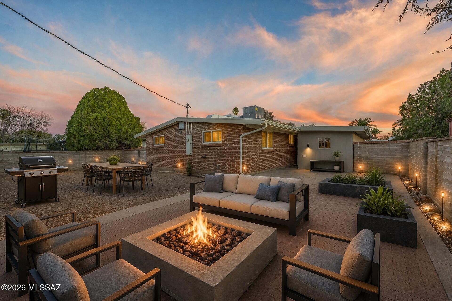 Exceptional value in today's market! Offering a rare combination of updates, location, and affordability, this move-in-ready home presents an opportunity buyers won't want to miss! NO HOA, a beautifully updated interior, and a spacious lot full of possibilities--this Central Tucson gem checks all the boxes! From the moment you arrive, you'll appreciate the perfect blend of modern updates and timeless charm. Step inside to discover a bright, welcoming interior filled with natural light thanks to newer windows that showcase the home's thoughtful upgrades and elegant plantation shutters. The remodeled kitchen serves as the heart of the home, offering a stylish and functional space for cooking, gathering, and everyday living. Updated flooring flows throughout the home, while new carpet in the the inviting living area is anchored by a cozy fireplace, creating the perfect place to relax, entertain, or unwind after a long day. Outside, the oversized lot provides endless potential. Whether you're dreaming of a backyard oasis, garden retreat, outdoor entertaining space, or simply enjoying the freedom that comes with extra room to spread out, this property offers a rare opportunity to make it your own. Additional peace of mind comes from a brand-new HVAC system installed in 2026, allowing you to enjoy Tucson summers with confidence. Conveniently located in the heart of Central Tucson, you're just minutes from Downtown Tucson, the University of Arizona, shopping, dining, biking paths, entertainment, and everything that makes Tucson such a desirable place to call home. Updated, move-in ready, and ideally located--this is the one you've been waiting for.