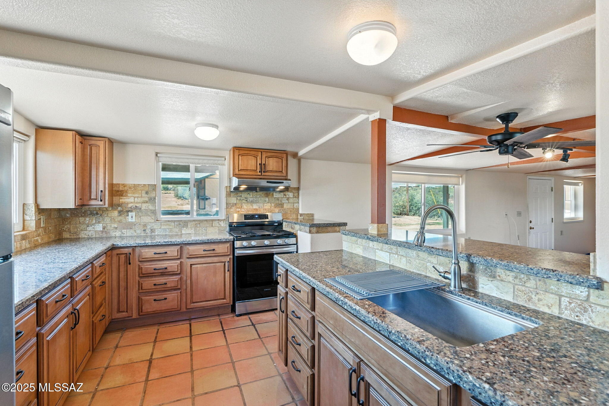 Imagine owning a private bungalow nestled in breathtaking surroundings with miles of State and Federal Land at your doorstep--perfect for riding, hiking, and endless exploration! This charming 2-bedroom, 1-bath home offers an unmatched combination of comfort and seclusion. Tucked away at the end of a tranquil trail, you'll enjoy stunning views and a sense of privacy like no other. The home features exquisite stonework from the 1870s, complemented by beautifully renovated kitchen, bathroom, and fireplace. Plus, two additional workshops equipped with electricity, along with a covered hoist for conveniently unloading items from your truck bed, make it ideal for all your hobbies and projects. Located in Pima County (lower taxes) near the Las Cienegas Conservation Area, this is a dream location for horse enthusiasts looking to explore the wild west as it once was. Experience the charm of Sonoita's finest wineries, just a short drive away, with Patagonia and Sierra Vista only 25 minutes from your doorstep. Don't miss out on the incredible birdwatching and unique native terrain this property offers. Call today and make it yours!