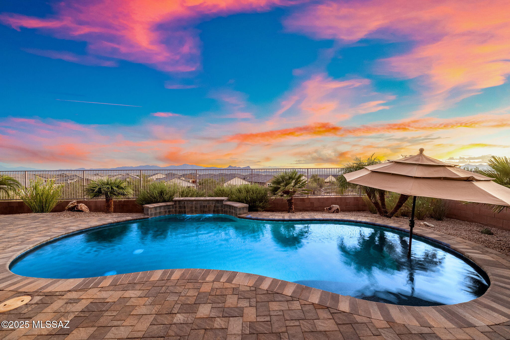 ''Pride Of Ownership'' is the first thing that comes to mind when you enter this gracious and inviting home. Within the home you will find generous living spaces, quality finishes, a refreshing neutral palette and easy care tile floors throughout. Outside there are views of four Mountain ranges including the Catalinas, Tortolitas, Tucson Mountains, and Santa Ritas, plus the Kitt Peak Observatory in the Quinlan Mountains. From the rear yard you can enjoy mountain views, star gazing, and city lights. As you arrive you will love the curb appeal of this property, and appreciate the mature desert landscape and classic stonework accents. Everything is perfectly ready and waiting for you to make this property your own. As you step inside this turn key home you will find a spacious Foyer Entry with a stone feature overlooking the large open great room. This space is where you will enjoy celebrating holidays and entertaining guests whilst enjoying the views of the perfectly manicured backyard and pool! Large windows welcome in natural light and offer framed views of the rear patio with epoxy flooring on this premium lot. The large, light-filled great room invites you into the open-concept center of the home, a space that is sure to become a favorite for entertaining or comfortable evenings relaxing. If you love to cook and entertain, the adjacent dining area and open, stylish kitchen with a large island has it all: stainless appliance package including gas range, painted soft-close cabinets with hardware, metal pullout shelving, topped with gorgeous quartz and butcher block counters, and plenty of storage and workspace. The generously sized deluxe owner's suite has a large window to give you a full view of the backyard and mountains. The updated ensuite bath is a luxurious retreat featuring dual sinks, large soaking tub, separate walk-in shower with dual shower head system, and two oversized walk-in closets.

Perfect for privacy, the home has a split floor plan. There are three additional bedrooms all with walk in closets and a recently updated guest bath on the opposite side of the home. All that, plus a laundry room, plenty of closets, and a two car extended length, epoxy floor garage which offers additional space for storage. The exceptional low care backyard elevates your outdoor living experience with a gorgeous view, a natural desert backdrop full of mountain and sunset views. The large covered patio has remote controlled roller screens and three ceiling fans. Enjoy the refreshing sparkling pool that has a water feature, pebble tec finish, solar heating, baja bench and custom pavers - your own private oasis.

Upgrades include ceiling fans, custom blinds throughout, 10ft ceilings, electric car charger, whole house water filtration, whole house air purifier, stone accents throughout, wainscot in the dining room, amazing curb appeal, updated lighting and so much more! Desirably located in the Tortolita Reserve neighborhood, you will enjoy the added privacy of natural desert surroundings behind and no rear neighbors. Conveniently located in Dove Mountain, close to Tortolita Preserve, Dove Mountain Park, The Ritz, golf, dining and more!

What are you waiting for? With all these features and spectacular VIEWS like this, it's your dream home and it won't last long!