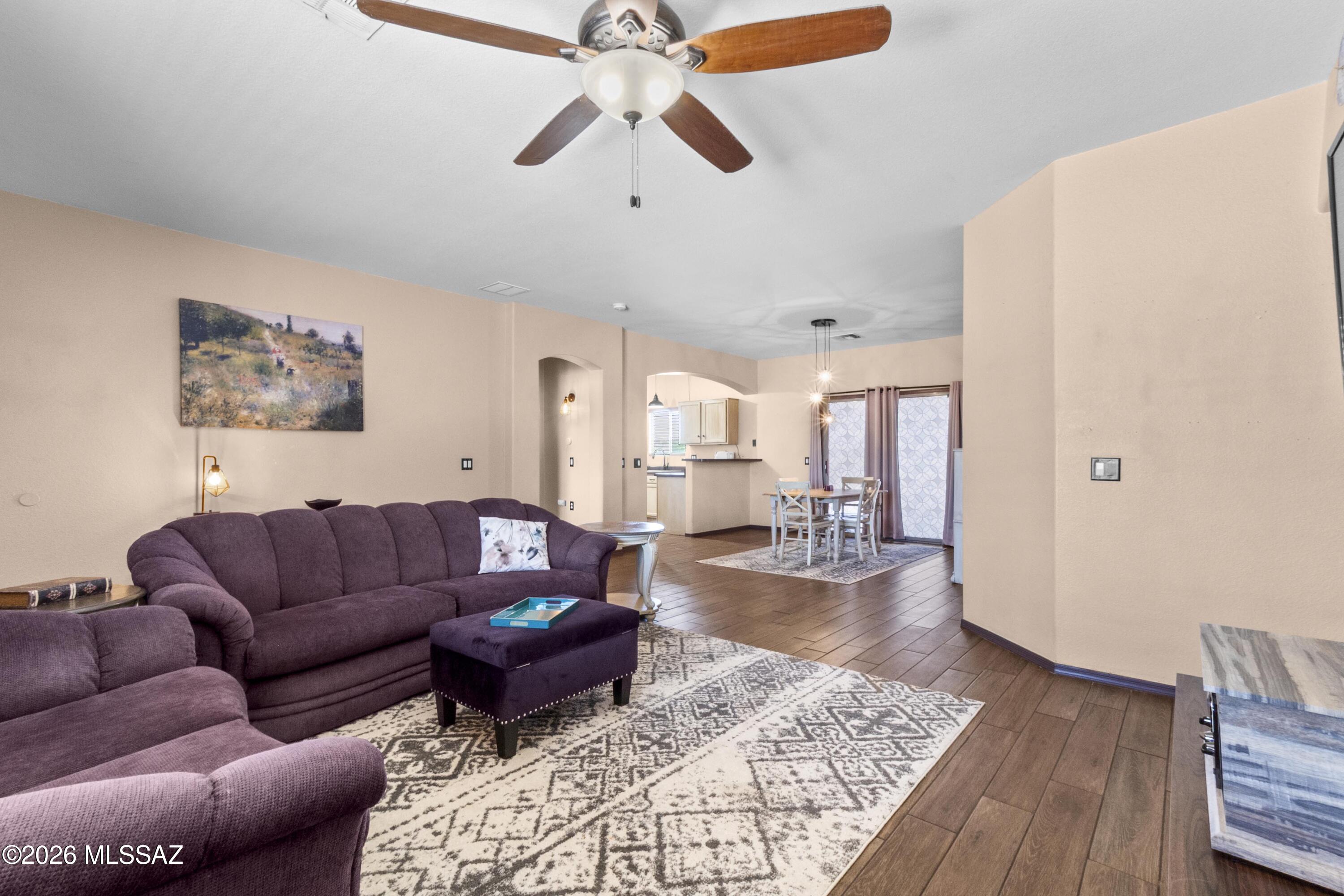 CALLING ALL Investors Great Opportunity for you! Home needs TLC with Incredible Potential on almost an acre Near Saguaro National Park. Opportunity knocks with this 4-bedroom, 2-bath offering space, views, and a highly desirable location just west of the park. Situated in a charming neighborhood with paved road access, this property is ready for transformation. Featuring a split bedroom floor plan, the home includes a spacious primary suite with walk-in closet, dual sinks, and separate shower and tub. The layout offers a large kitchen with abundant cabinetry, pantry, and dedicated laundry room, along with a living area highlighted by wood like Tile flooring. Outdoor living is ideal with full-length covered front and rear porches perfect for taking in the open space and surrounding desert views. The 3-car garage adds functionality and value for those looking to renovate, flip, or create a custom retreat. This property does need TLC and is priced accordingly ideal for investors or buyers ready to bring their vision to life. Sold AS-IS. No warranties, CLUE, or SPDS. Buyer to verify all information. Escrow is open with court documents in place. Don't miss this chance to capitalize on location, land, and potential.