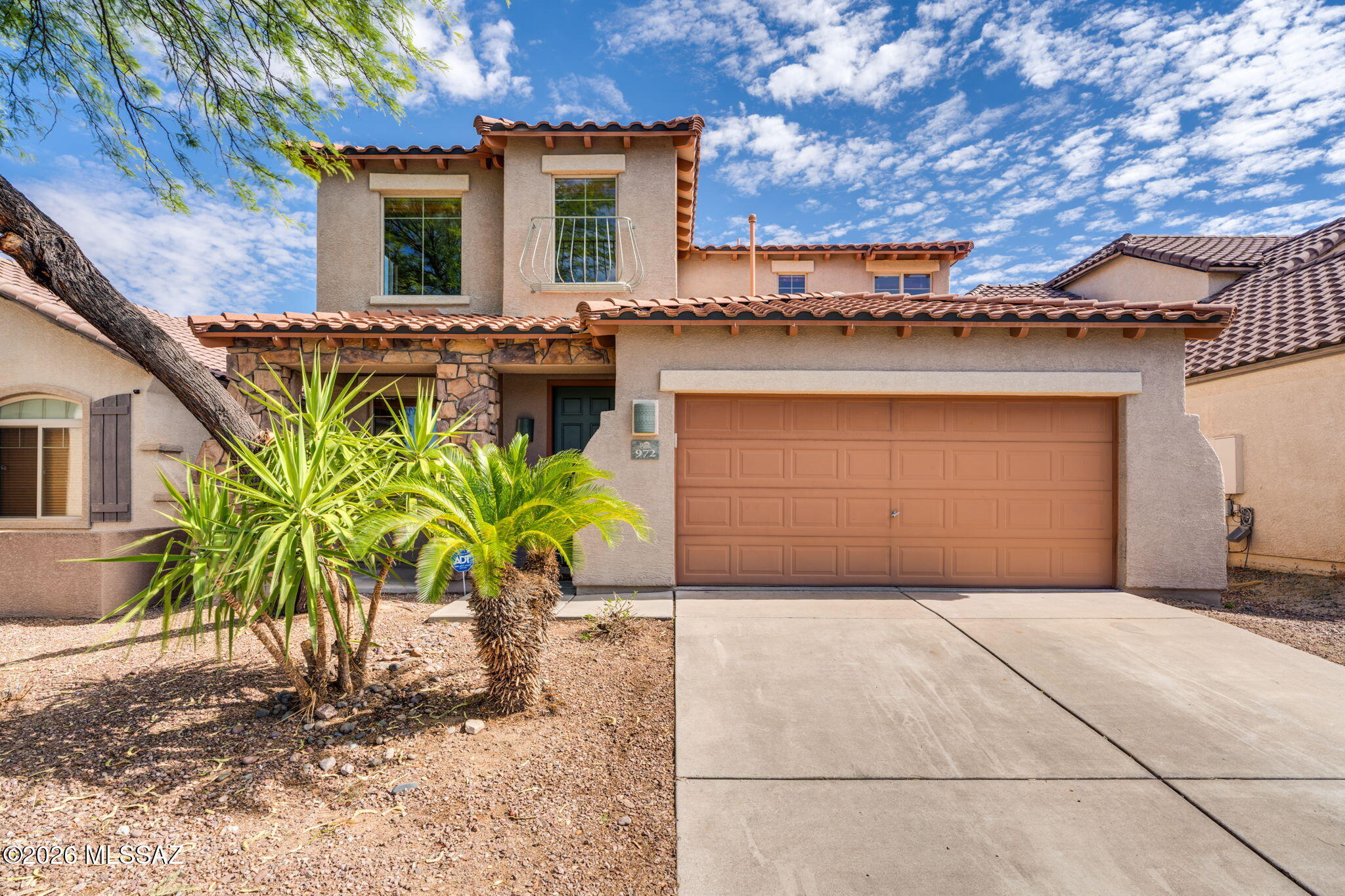 Just in time for summer! Beat the heat in your new pool home in desirable Rancho Vistoso. This home is move-in ready with an updated kitchen featuring quartz countertops and stainless steel appliances, both completed in June 2026, plus a new water heater. From the moment you step inside, the home feels welcoming, with soaring ceilings and abundant natural light streaming through the windows and updated warm laminate flooring. There is plenty of room to spread out with a spacious living and dining area, along with a massive family room and an eat-in-kitchen. A powder room on the main level adds convenience for guests, and the large primary suite is also located downstairs for added privacy and accessibility. Upstairs, a loft provides the perfect space for a reading nook. Three generously sized bedrooms share a large bathroom with dual sinks. The heated pool and low-maintenance yard are ideal for summer living, and the pool includes safety fencing for added peace of mind. A three-car tandem garage offers plenty of room for an extra vehicle, home gym, or additional storage. Do not miss the opportunity to make this exceptional Oro Valley home your own!