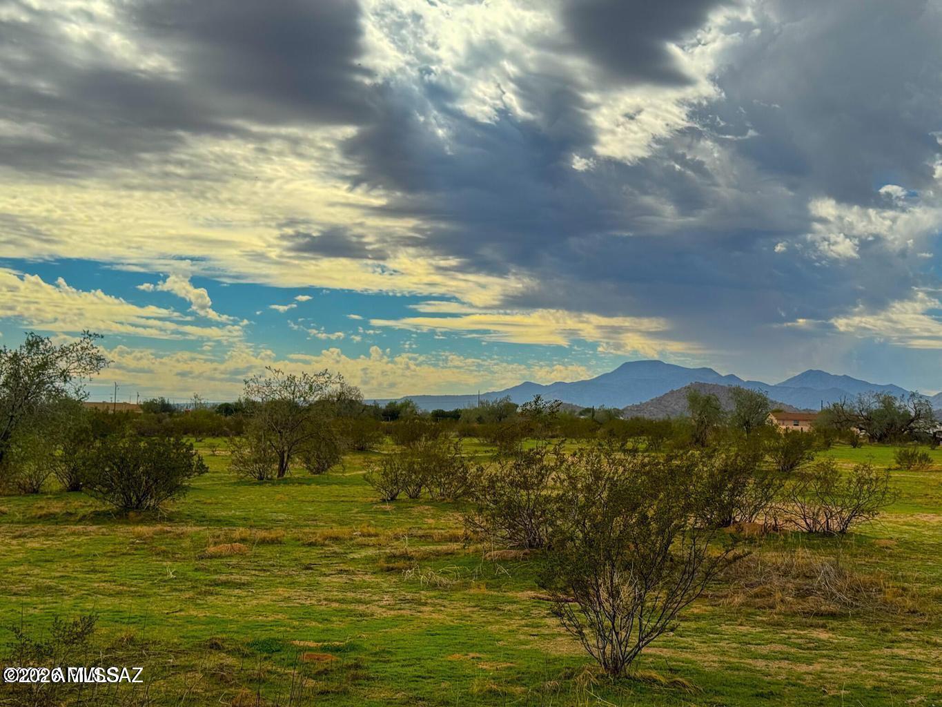 Fantastic, level lot surrounded by mountain views and power at the paved street. Zoned GR, you can build, place a manufactured home, have horses, and live freely and privately with no HOA or CC&R's. Additional acreage available.