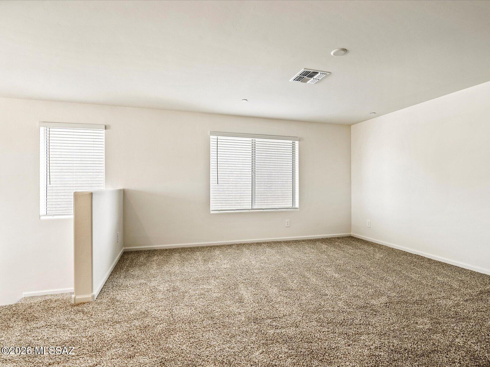 Welcome guests with ease in the private first-floor bedroom and full bath--perfect for visitors or multigenerational living. A dramatic double-height foyer creates an impressive entry, while the spacious upstairs loft offers the ideal setting for a game room, media space, or home office. Located in the desirable Mandarina community in Marana, AZ, residents will enjoy planned amenities including a resort-style pool, pickleball courts, playgrounds, a dog park, and more. Move-in ready with washer, dryer, refrigerator, and whole-home blinds. Built with energy-efficient features designed for comfort, savings, and peace of mind.