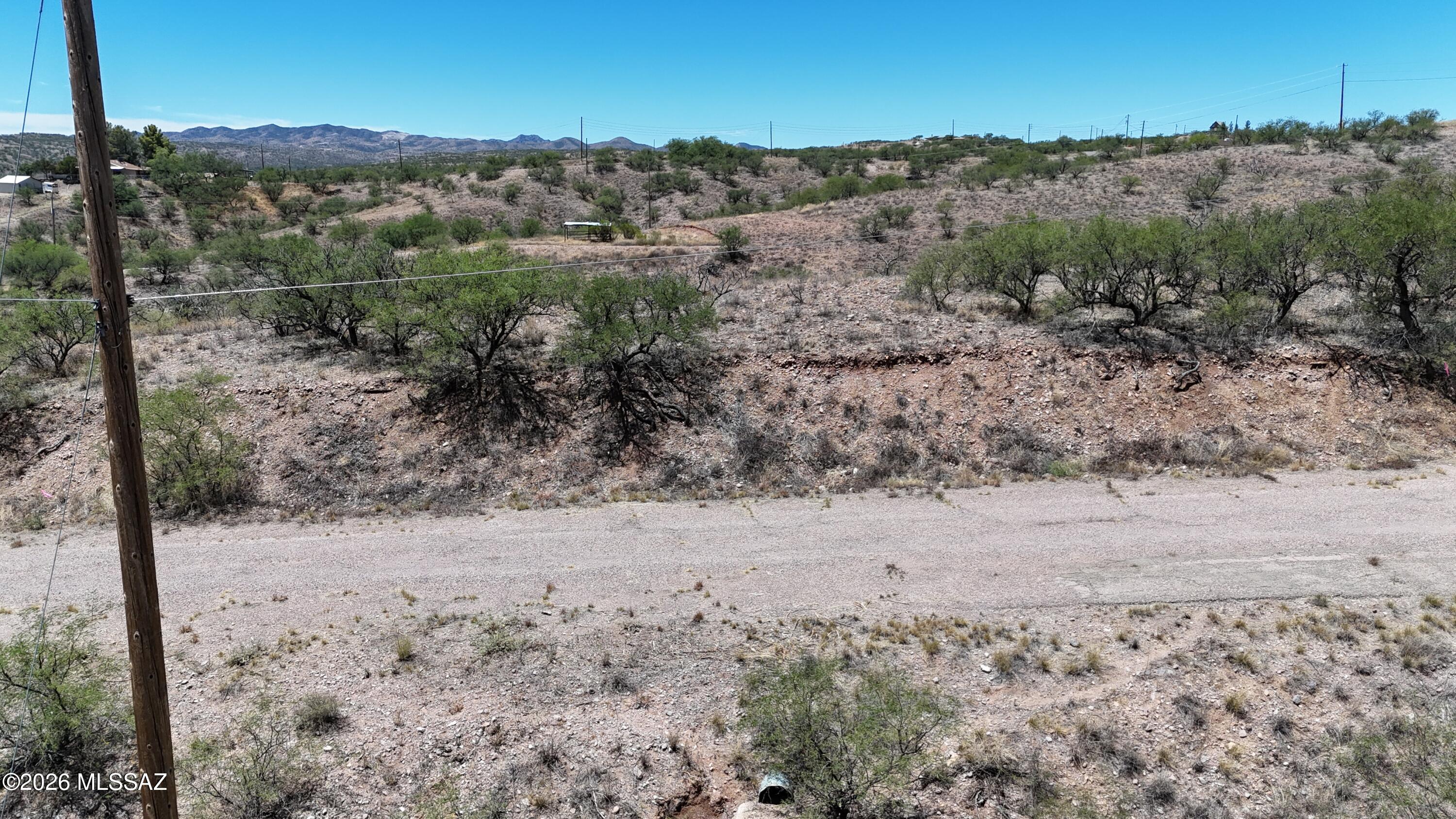 Nearly 6/10th of an acre residential lot on quiet West Side of Rio Rico.  Paved road.  Only about 2 miles to the shopping center and highway entrance.