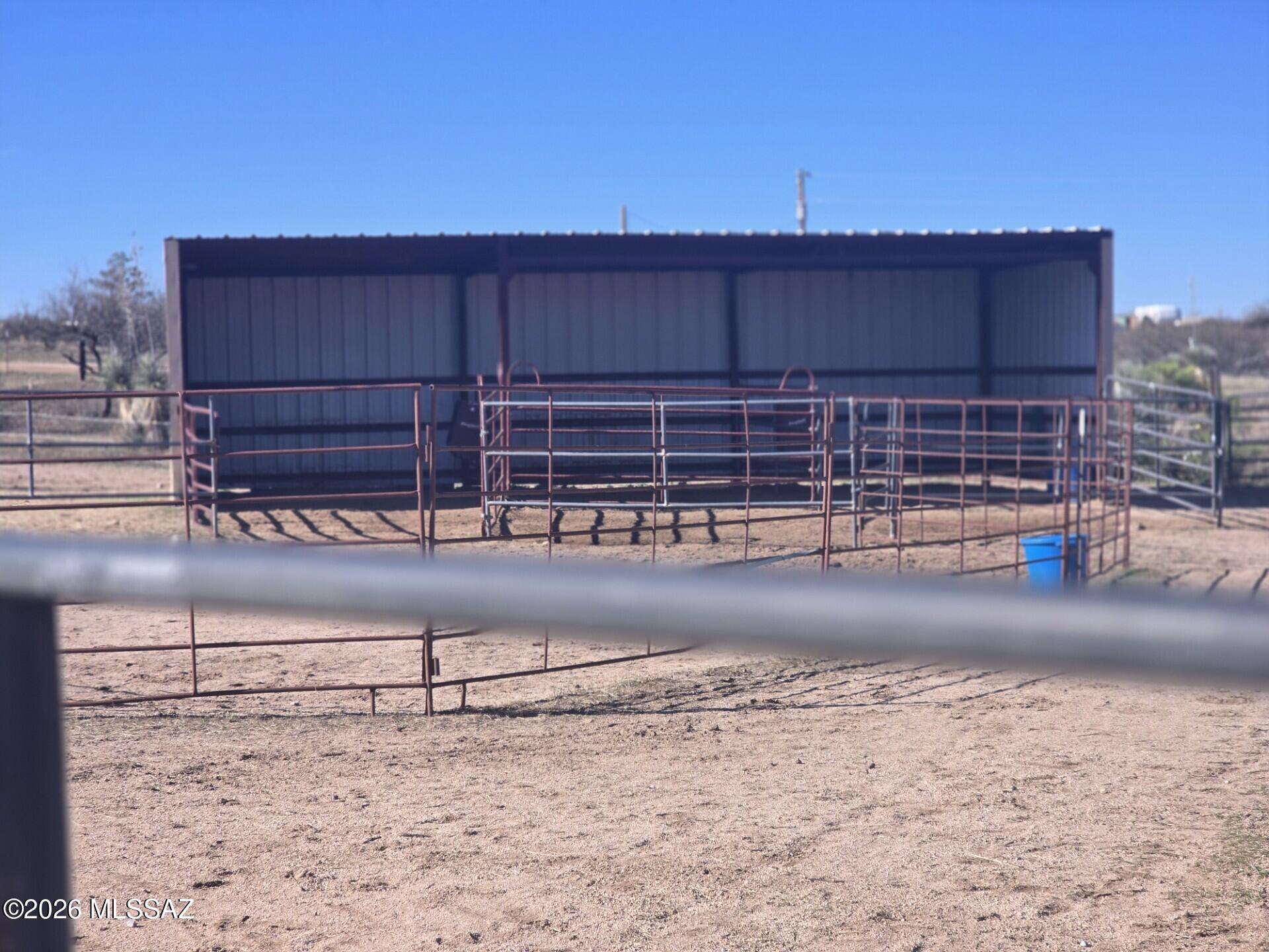 Partially fenced 4.63 Acre lot with three-sided Metal building 15' X 36', and 10' high. Round pen and other horse panels available by separate Bill of Sale. Taxes shown are for 9+ acres that include lot to the east with a home, New survey markers will identify lot lines for this parcel.