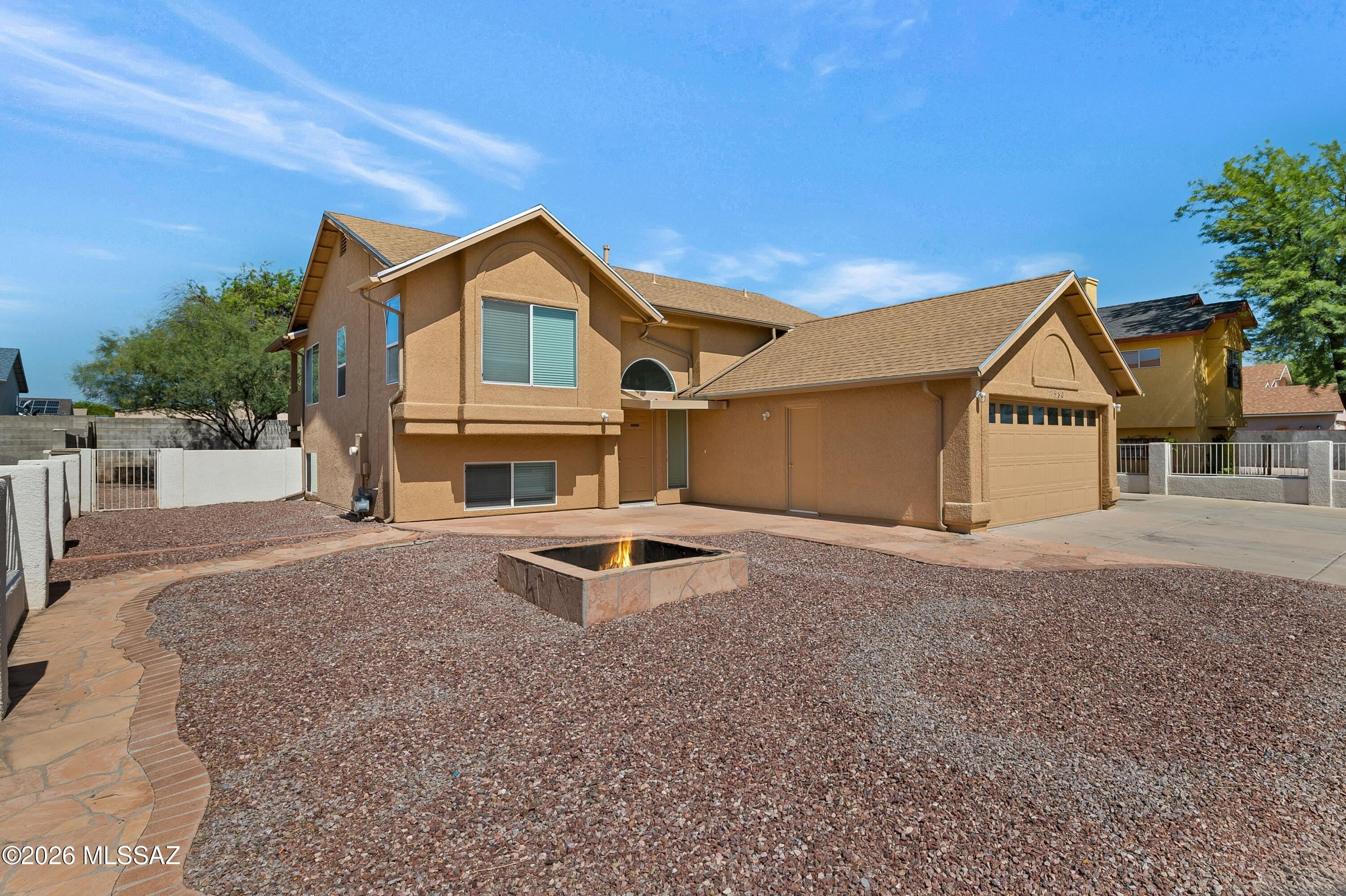 Welcome to 7380 S. Camino De La Tierra, a spacious 4 bed 2.5 bath home offering over 2,200 square feet of comfortable living in Tucson's desirable Mission West community. This thoughtfully designed split-level floor plan features multiple living spaces, a bright and functional kitchen, and generous bedrooms that provide flexibility for family, guests, or a home office. A brand new roof with 5 year warranty offers peace of mind and adds lasting value. Step outside to the patio and private backyard with mountain views- perfect for relaxing and entertaining. Enjoy the third detached garage as a hobbyists dream for all your toys. Come take a look today before it's gone!